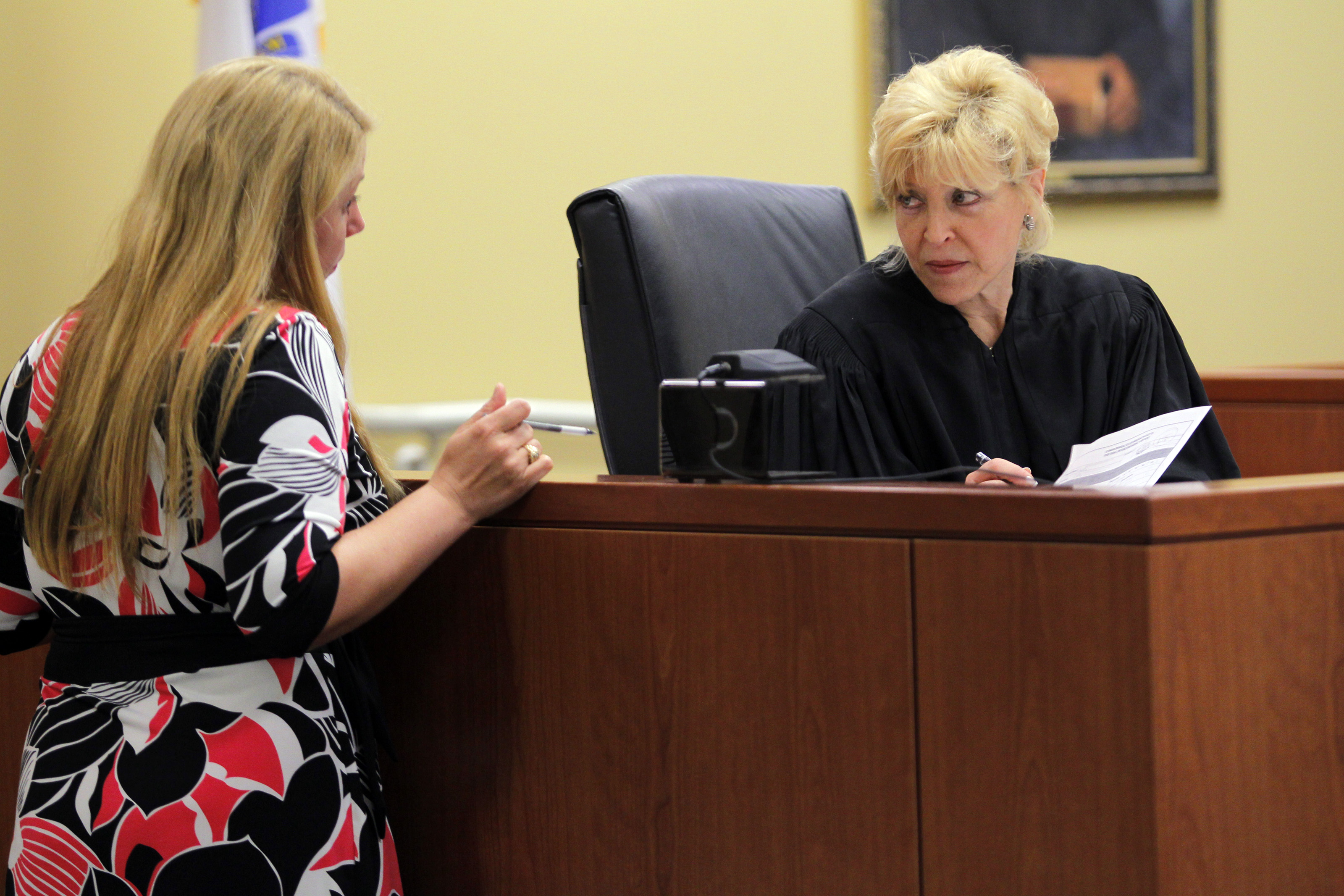 Judge Roanne Sragow spoke with probation officer Katherine Seoana during the arraignment.