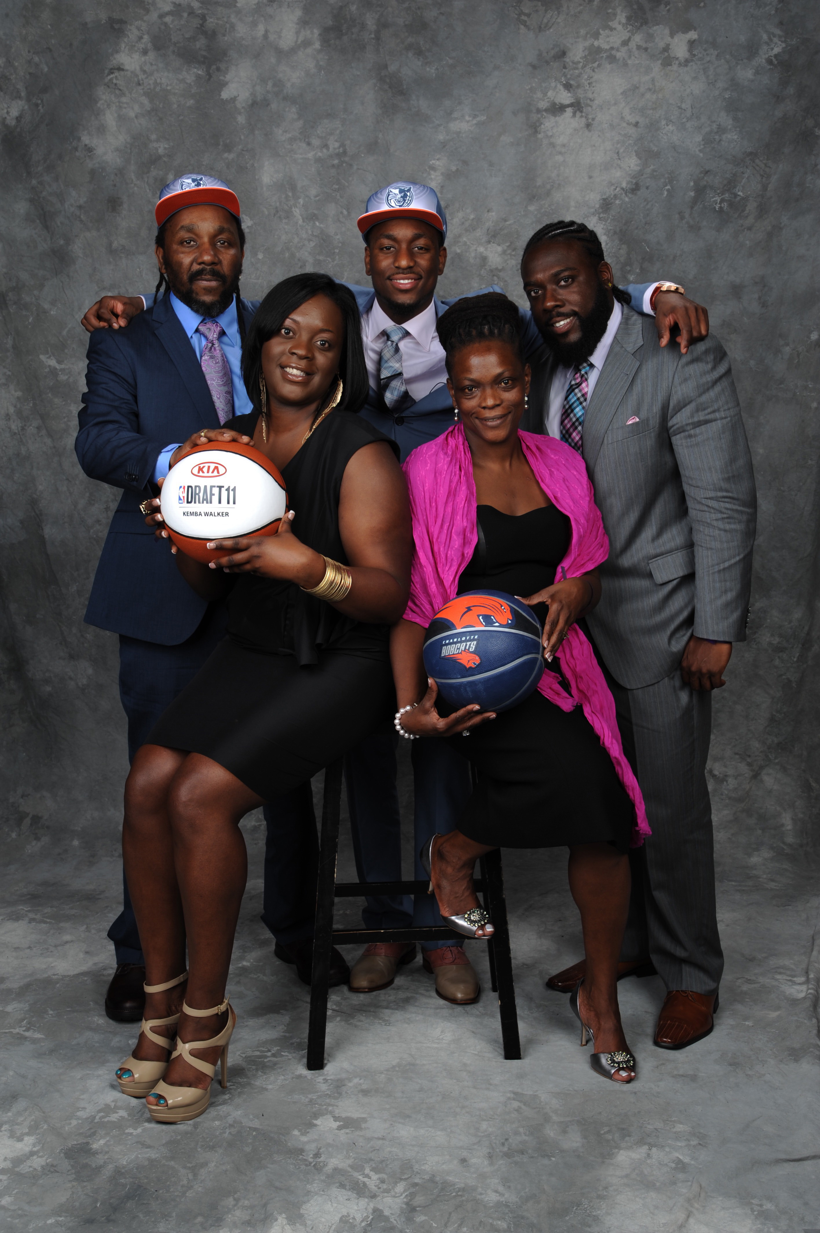 Kemba Walker (back center) is shown at the 2011 NBA Draft with, from left, father Paul Walker, sister Sharifa Nesbitt, mother Andrea Walker, and cousin Kedow Walker.