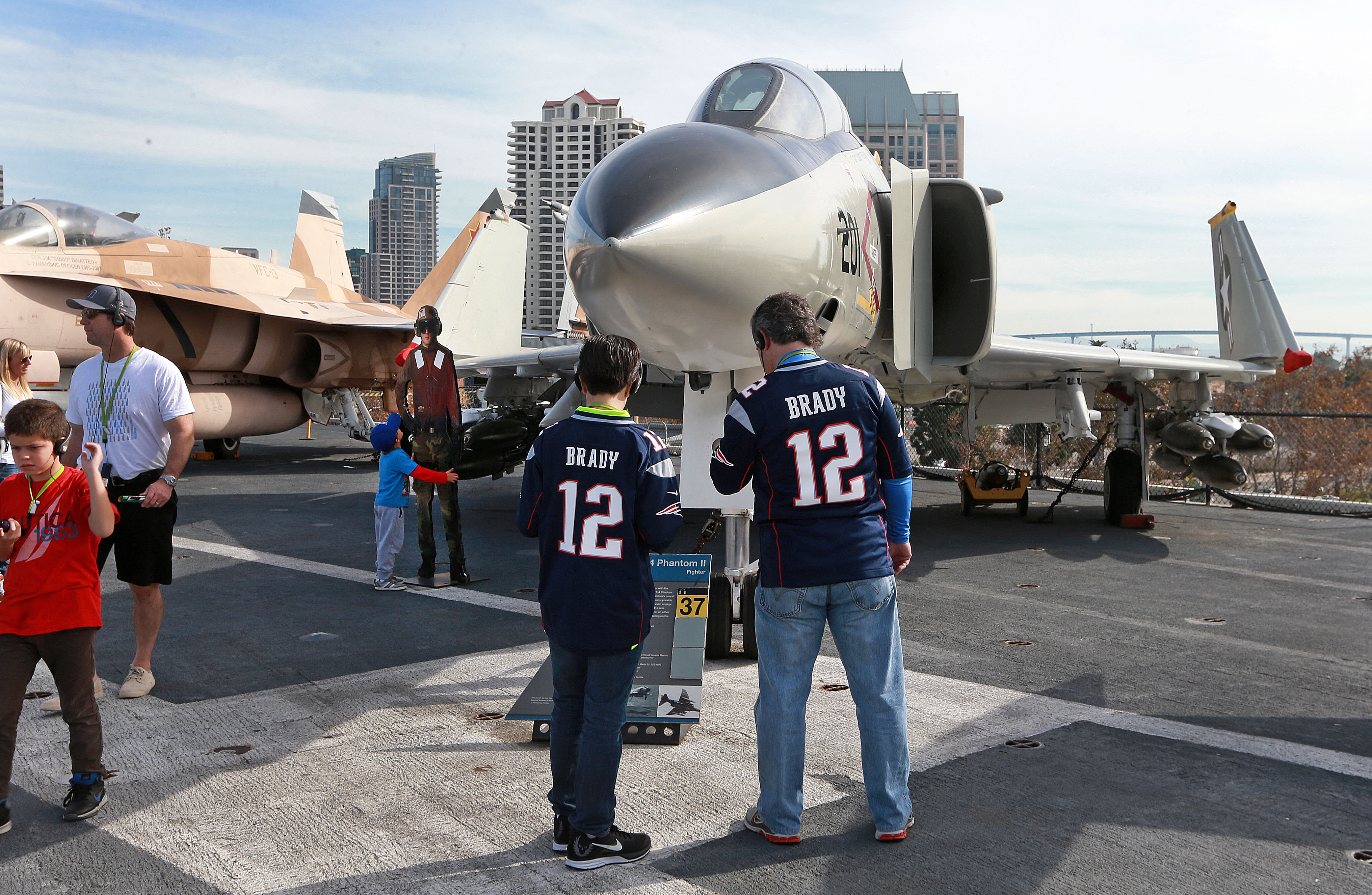 Patriots fans were all over San Diego this weekend, including these two who wore their Tom Brady jerseys as they checked out a fighter jet Sunday afternoon on board the USS Midway, the aircraft carrier that is now a floating museum in San Diego Harbor.