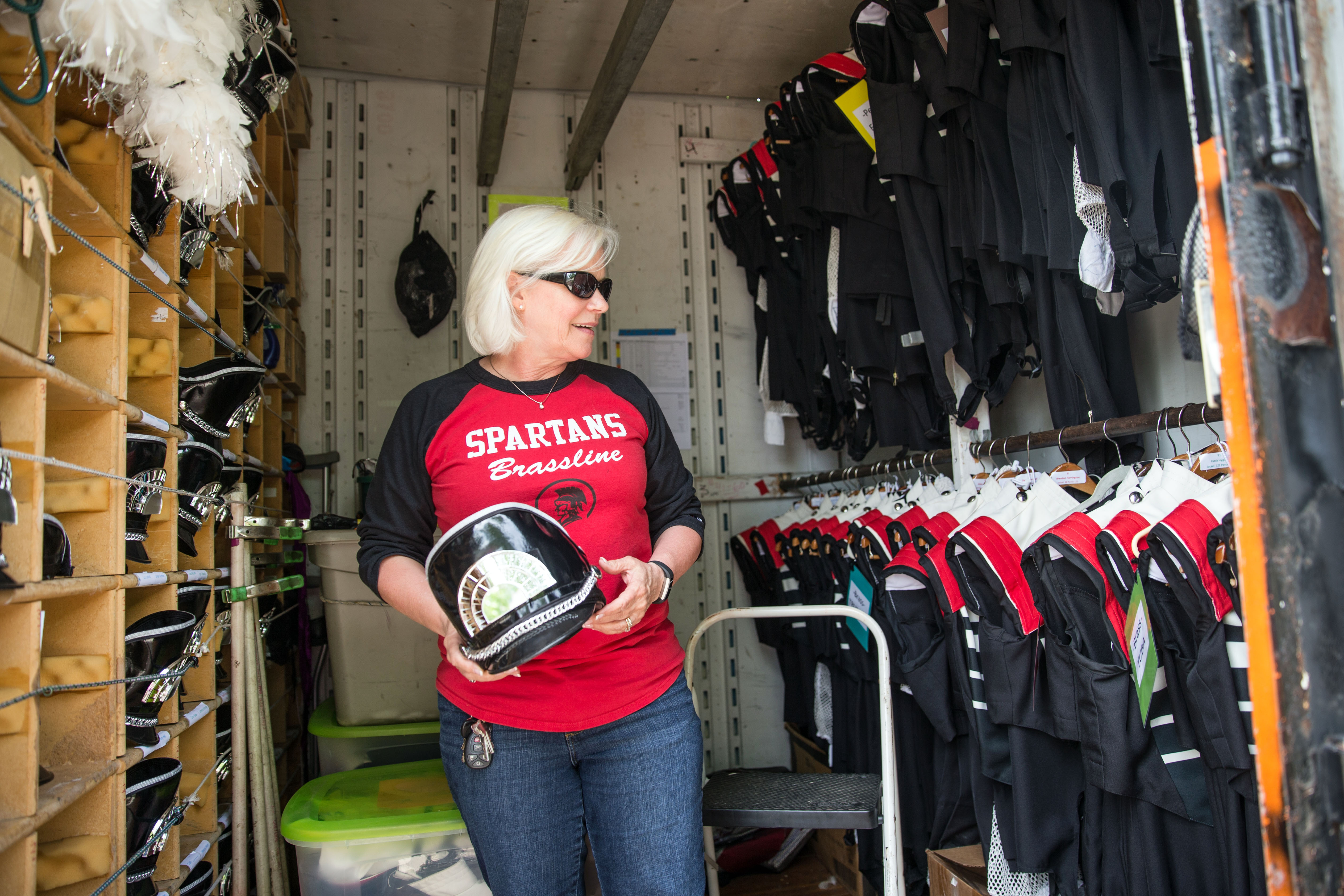 Operations director Ann Prendergast inspected the Spartans uniforms.