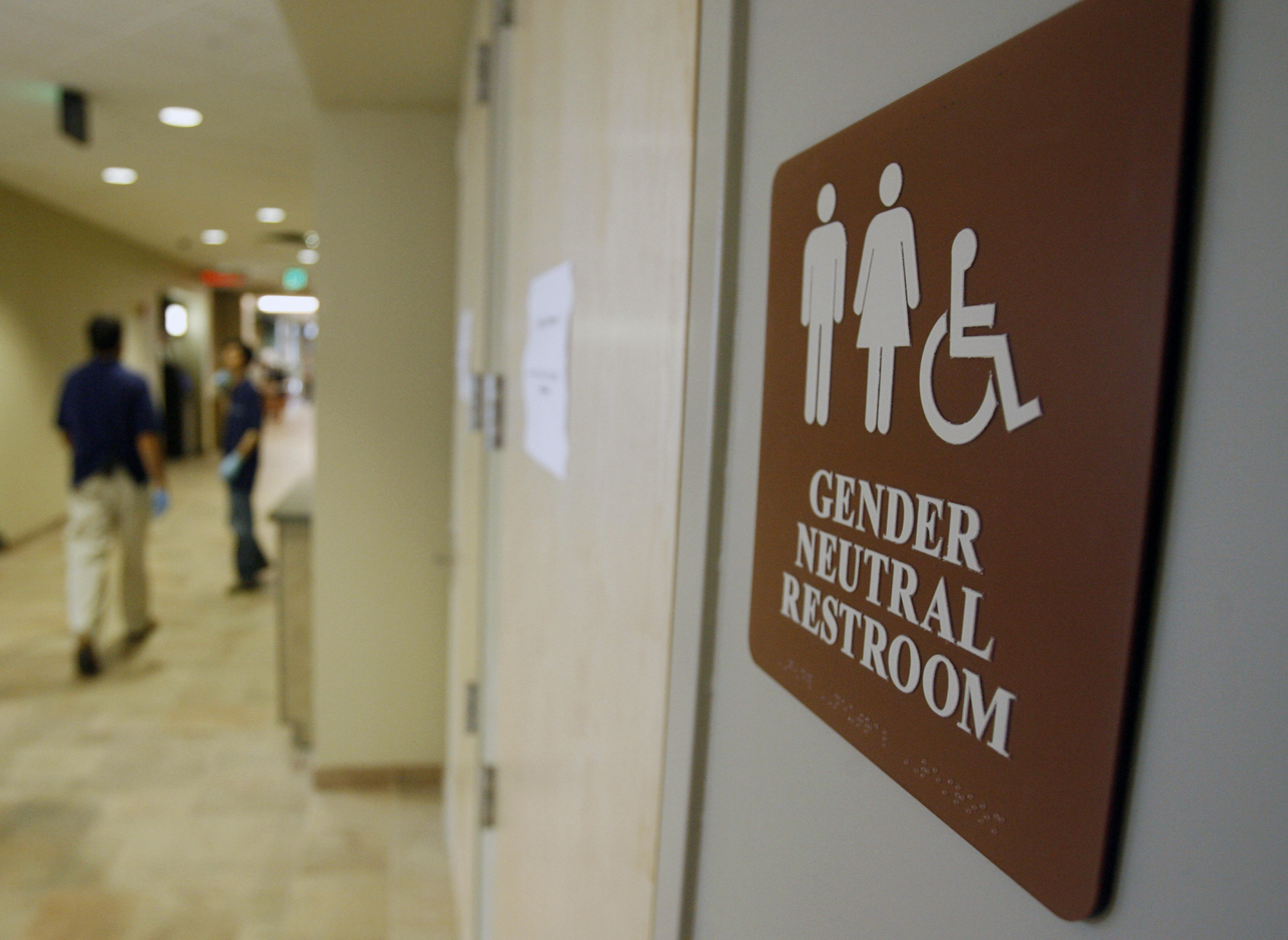 A bill that would close a loophole in an earlier Massachusetts law and protect transgender people in public areas is stuck in a joint committee. Above: A gender-neutral bathroom at the University of Vermont’s campus in Burlington.