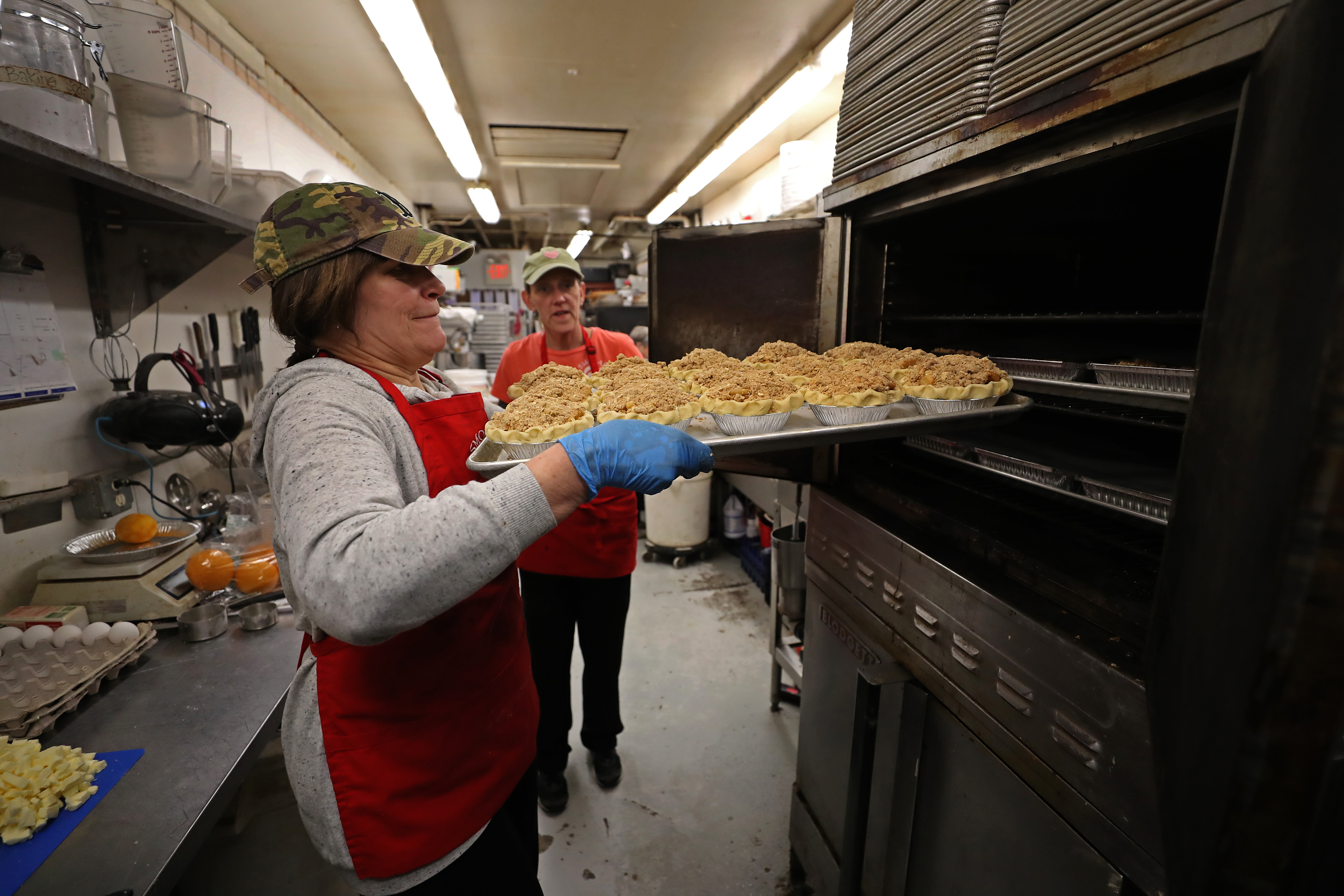 June D. Flood and Jo Newman prepare pies at Smolak Farms.