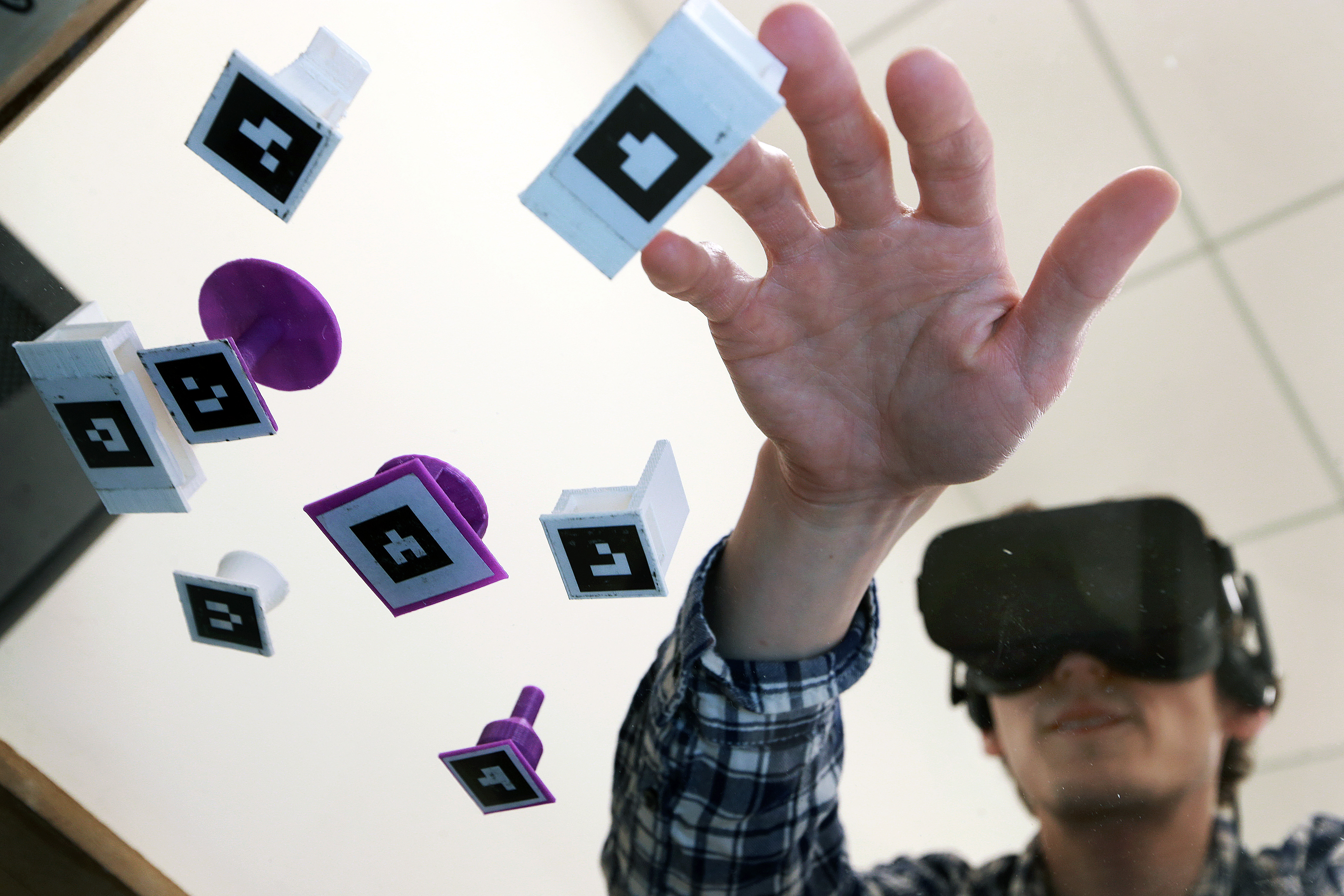 Mike Festa used a 3D device that allowed him to move pieces that represent furniture in the Wayfair Virtual Reality Lab.