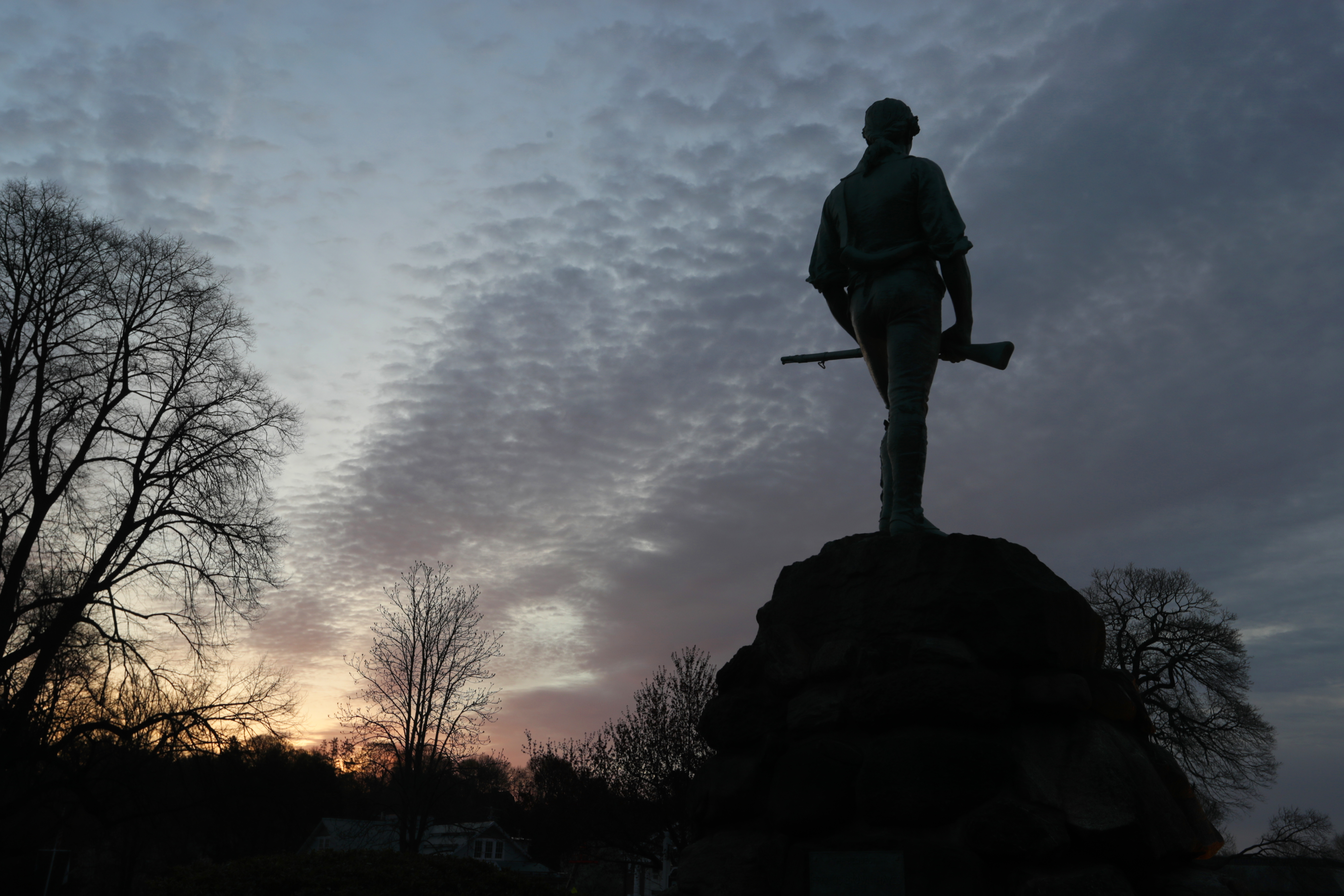 The Minuteman statue at Lexington's battle green at dawn on Patriots Day.