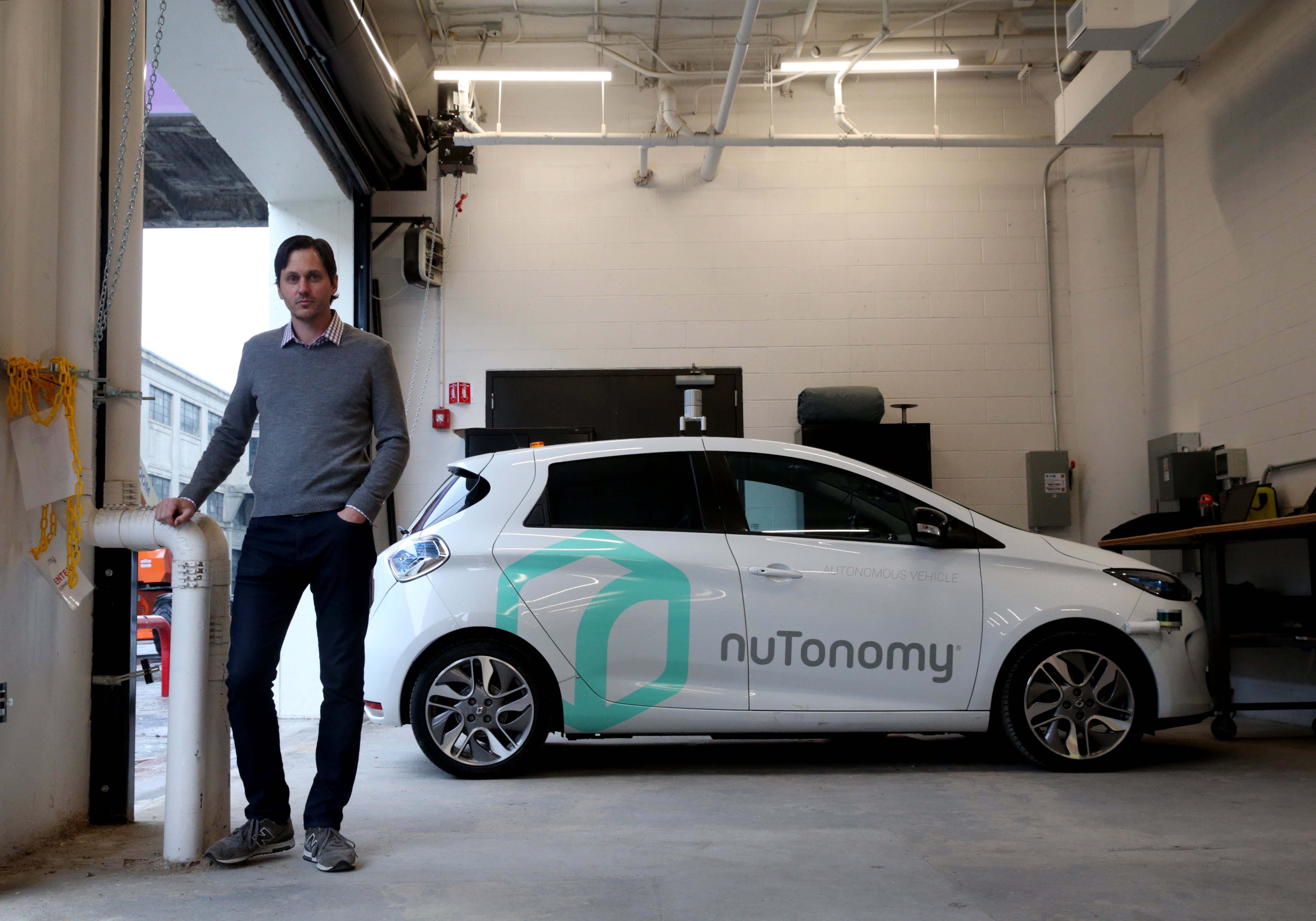 Karl Iagnemma co-founder of nuTonomy posed for a portrait with a self-driving car in Boston.