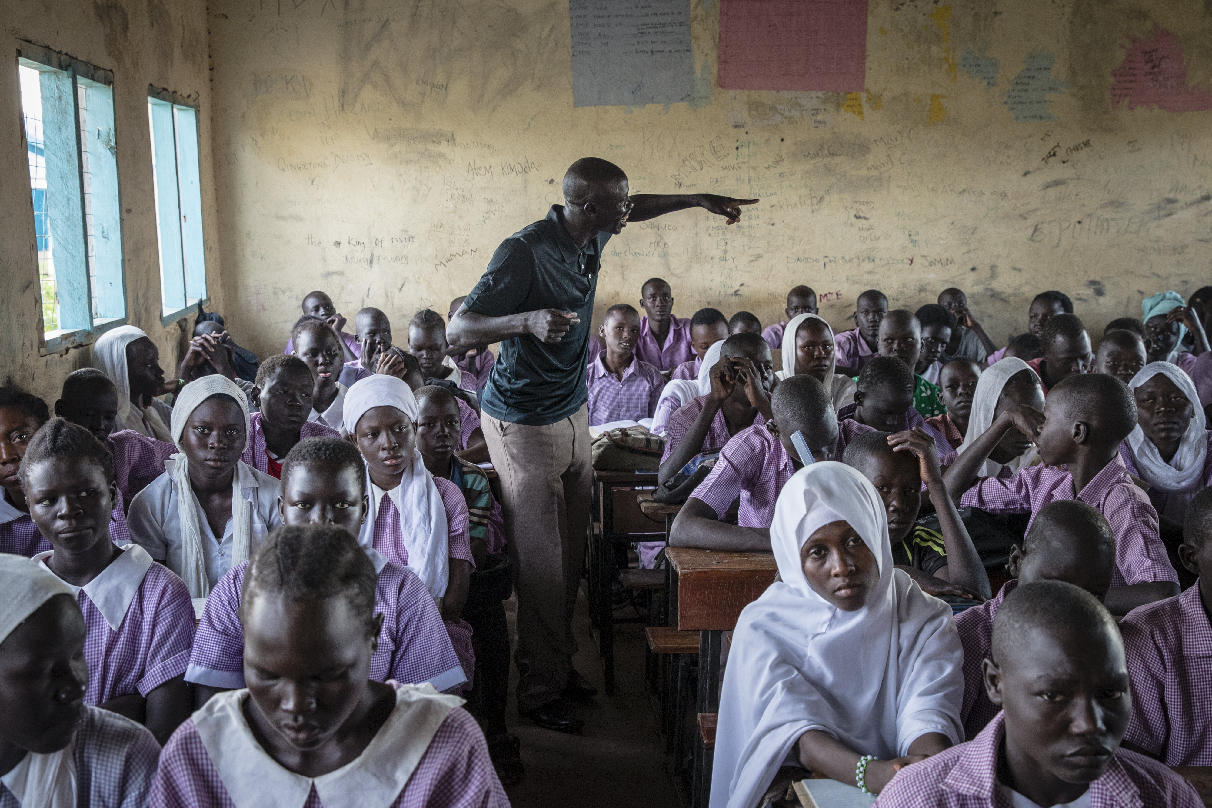 Teacher Kuku Kurimagi Agoumi, a refugee from South Sudan and a student of SNHU’s online degree program, led his class in study at a school at the UNHCR refugee camp in Kakuma. Teaching is one of the few jobs refugees are authorized to hold in the camp.