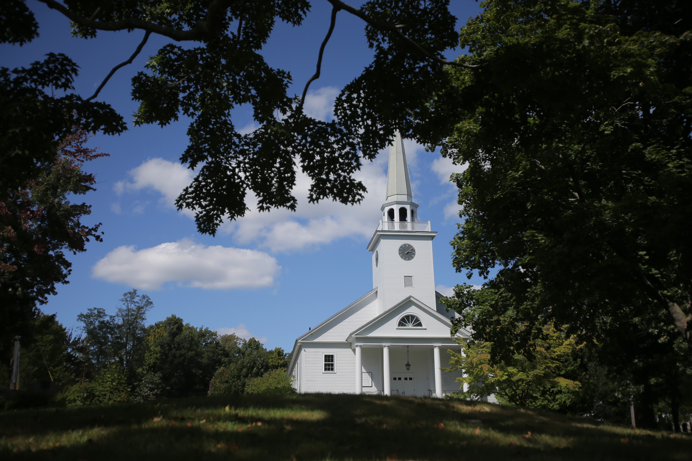 The Unitarian Universalist Church sits above the town common in Harvard.