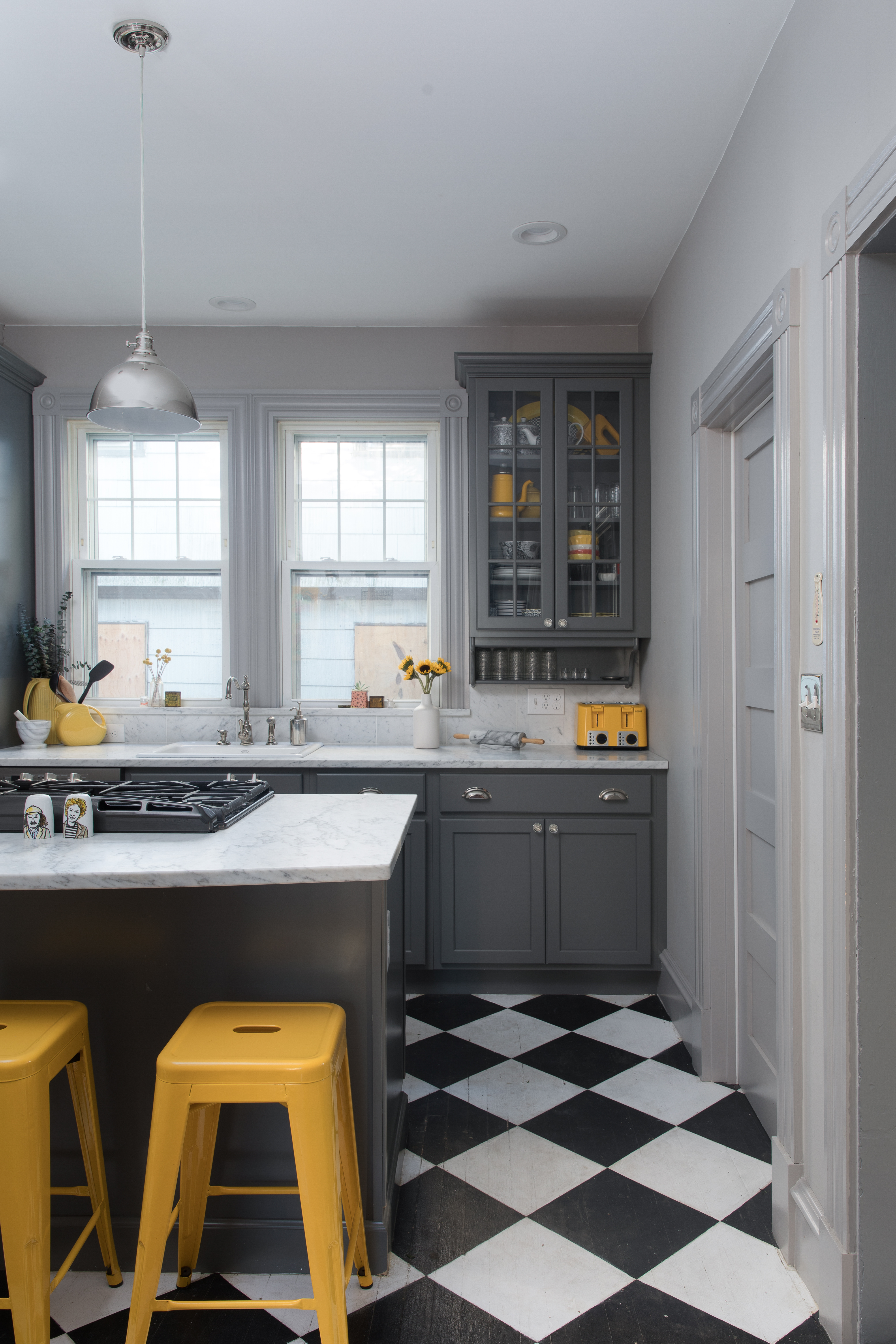 Dewhirst splurged on Carrara marble kitchen countertops, which picked up stains during her housewarming party. “I believe imperfections make the marble beautiful, but it’s hard to see the first one,” she says.