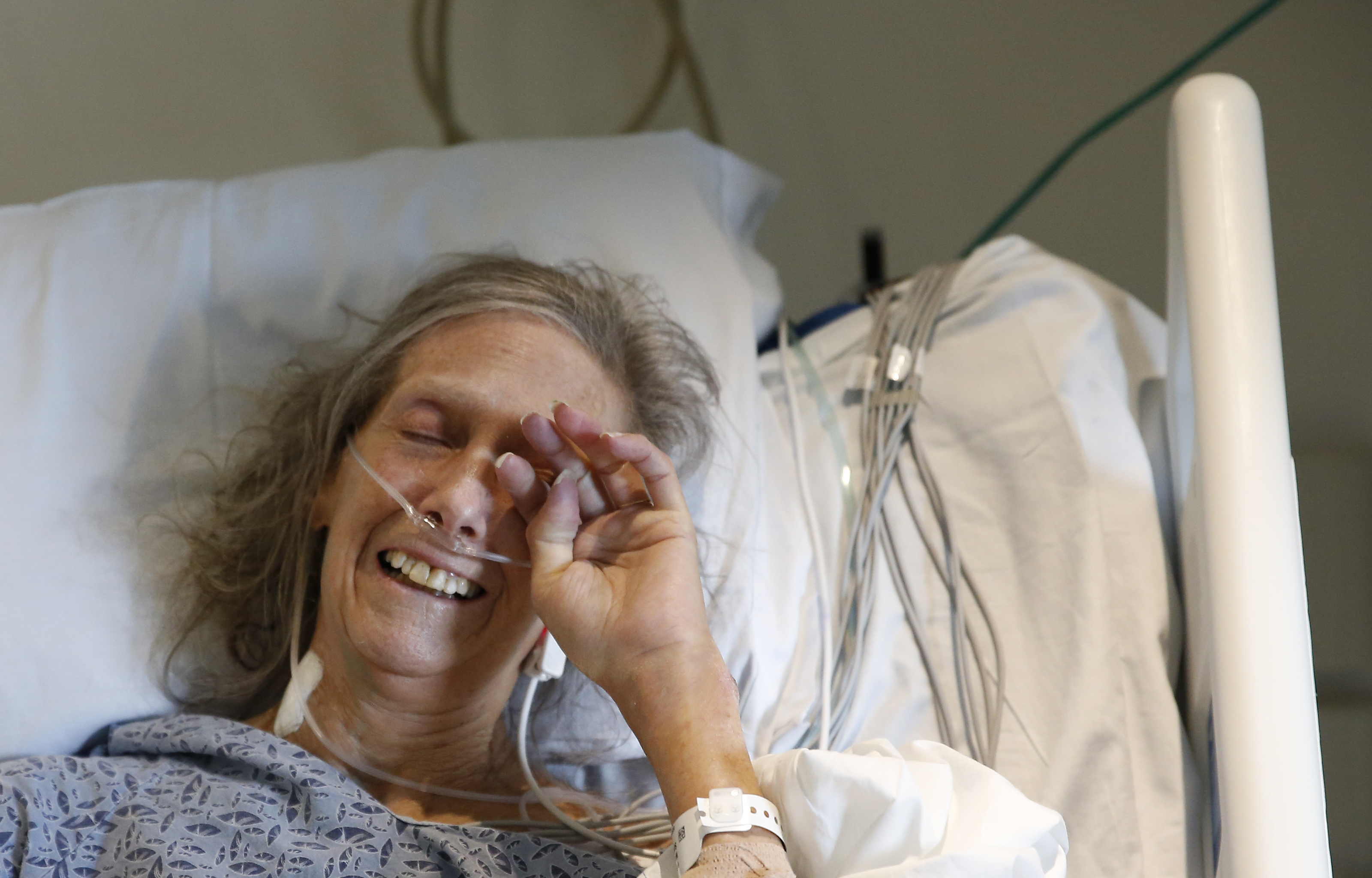 Patient Susan Martillotta cried as she sang along to “Silent Night,” despite tubes in her nose.