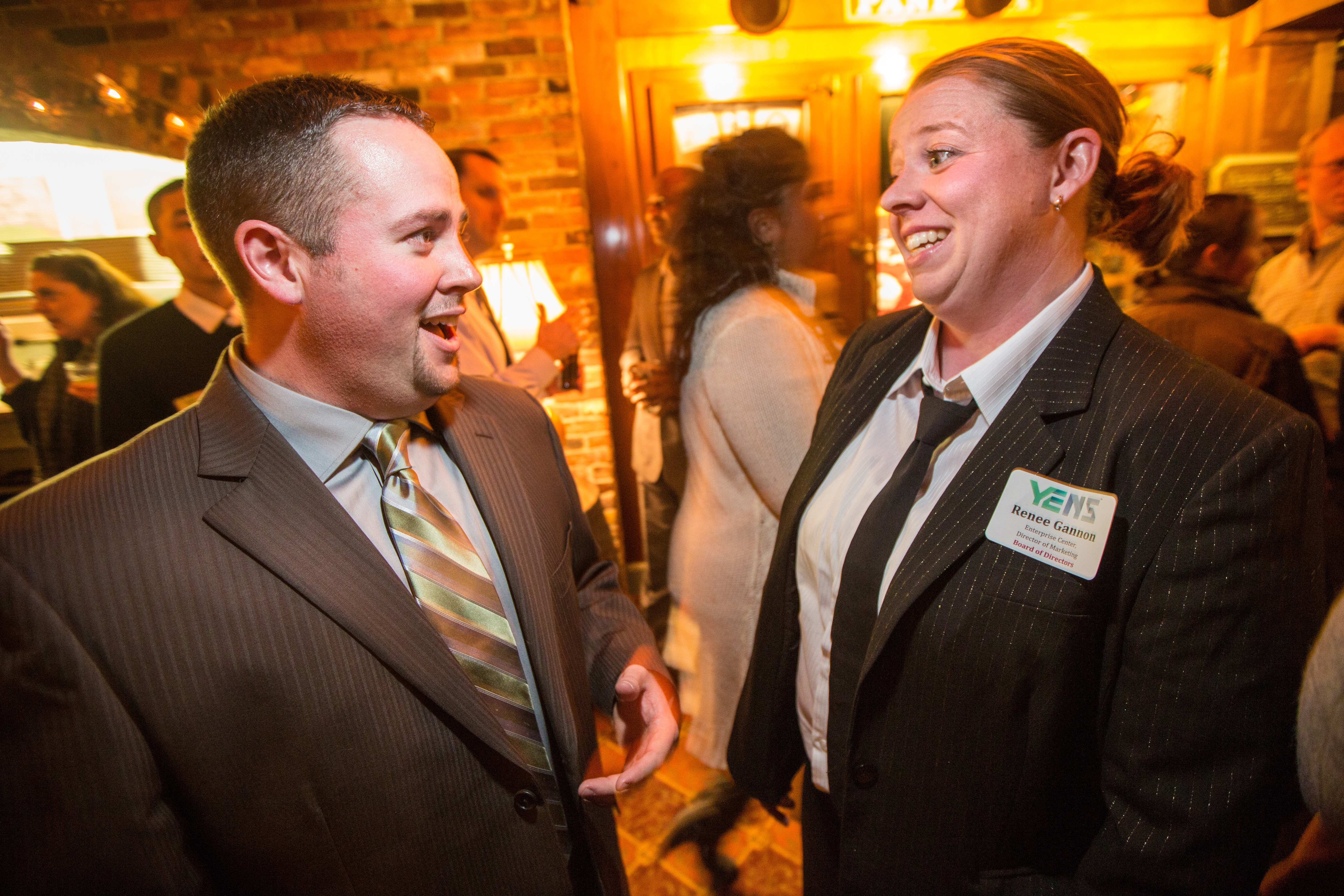 President Andrew E. Turner (left), an automotive consultant, speaks with Vice President Renee Gannon, Director of Marketing at Enterprise Center, during a Young Entrepreneurs of the North Shore event held at Victoria Station in Salem.