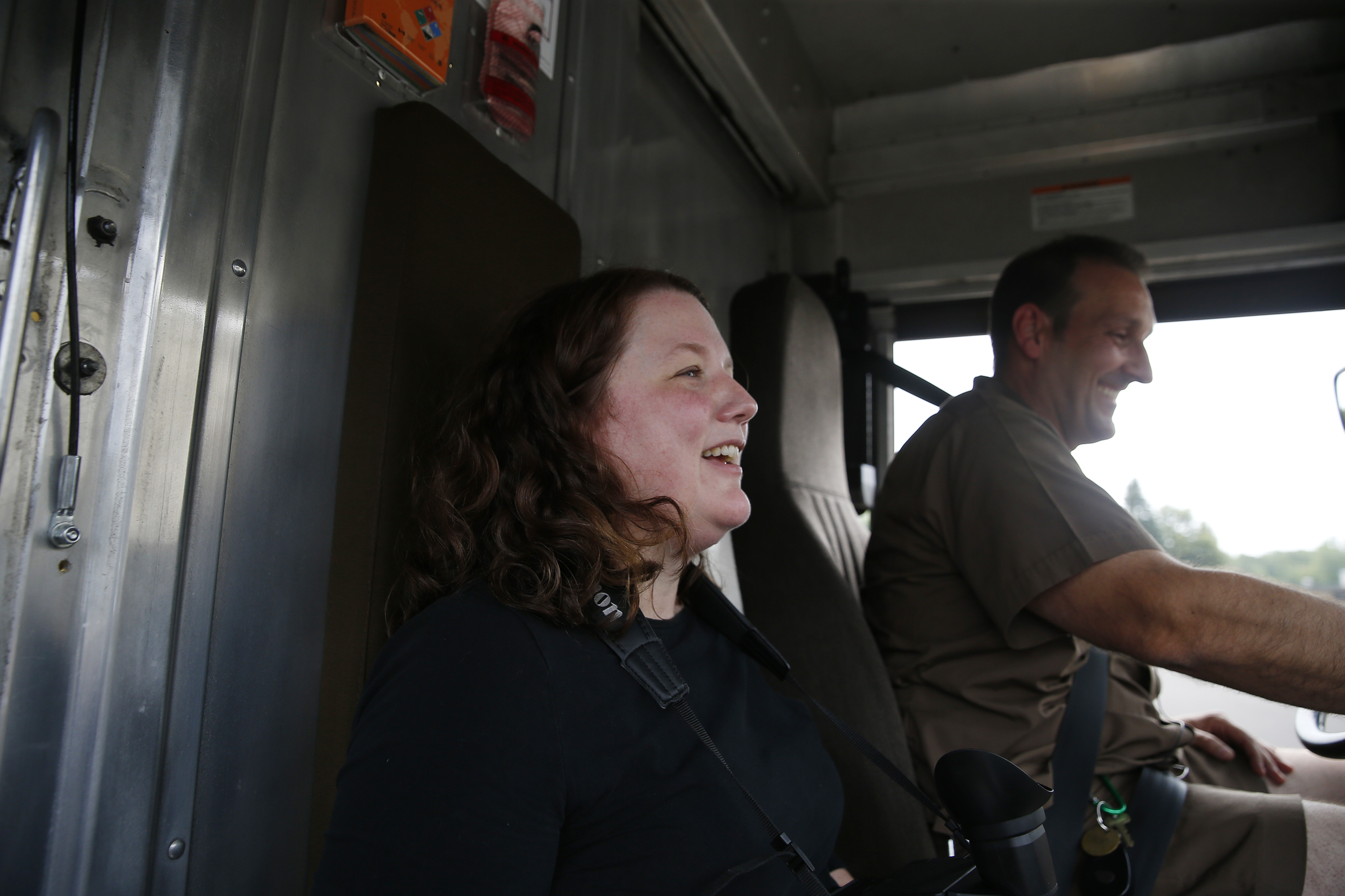 Reporter Stacey Myers gets some defensive driving pointers from UPS trainer Tracy Marks.