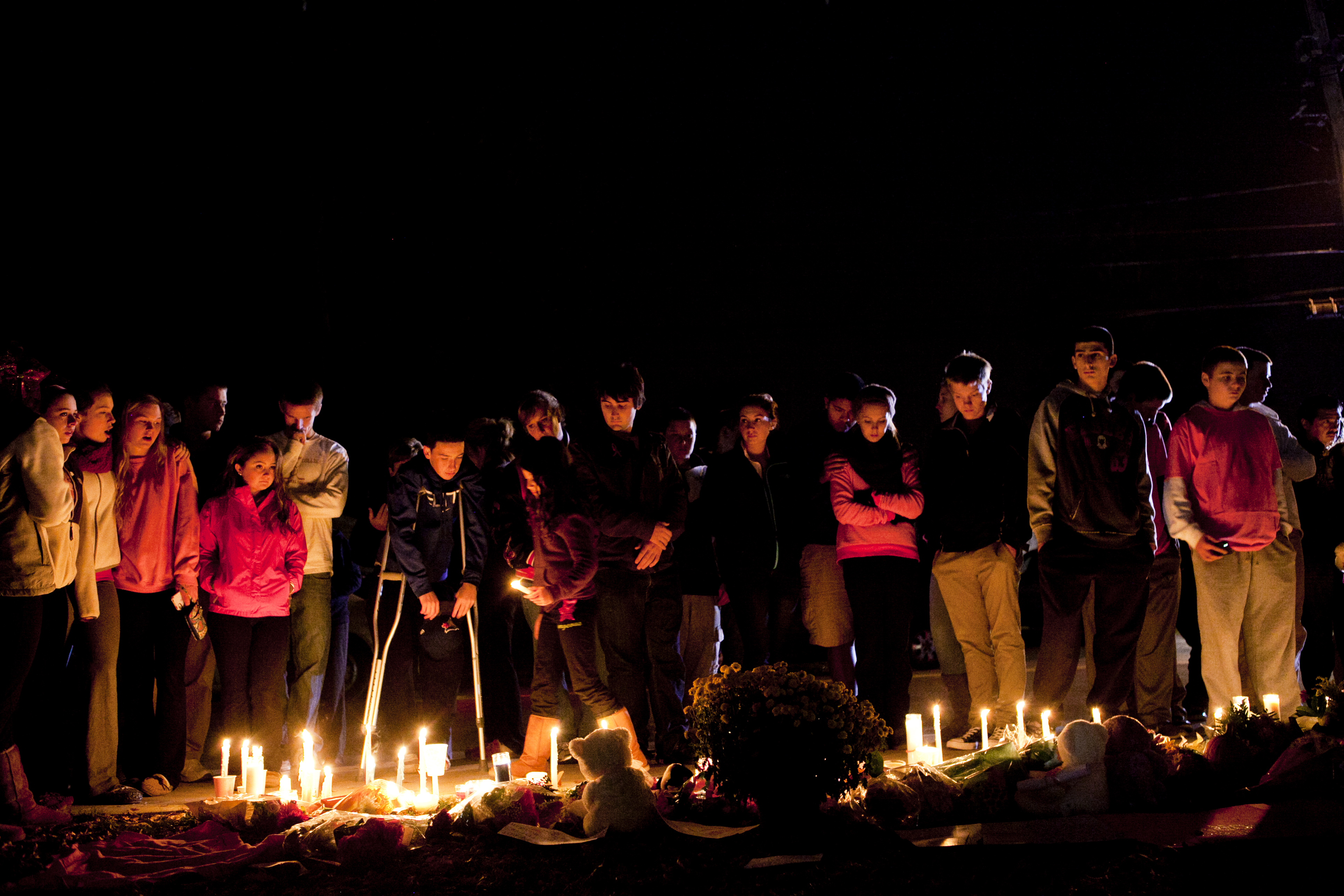 Students, staff, and family gathered outside Danvers High for a candlelight vigil for slain teacher Colleen Ritzer.
