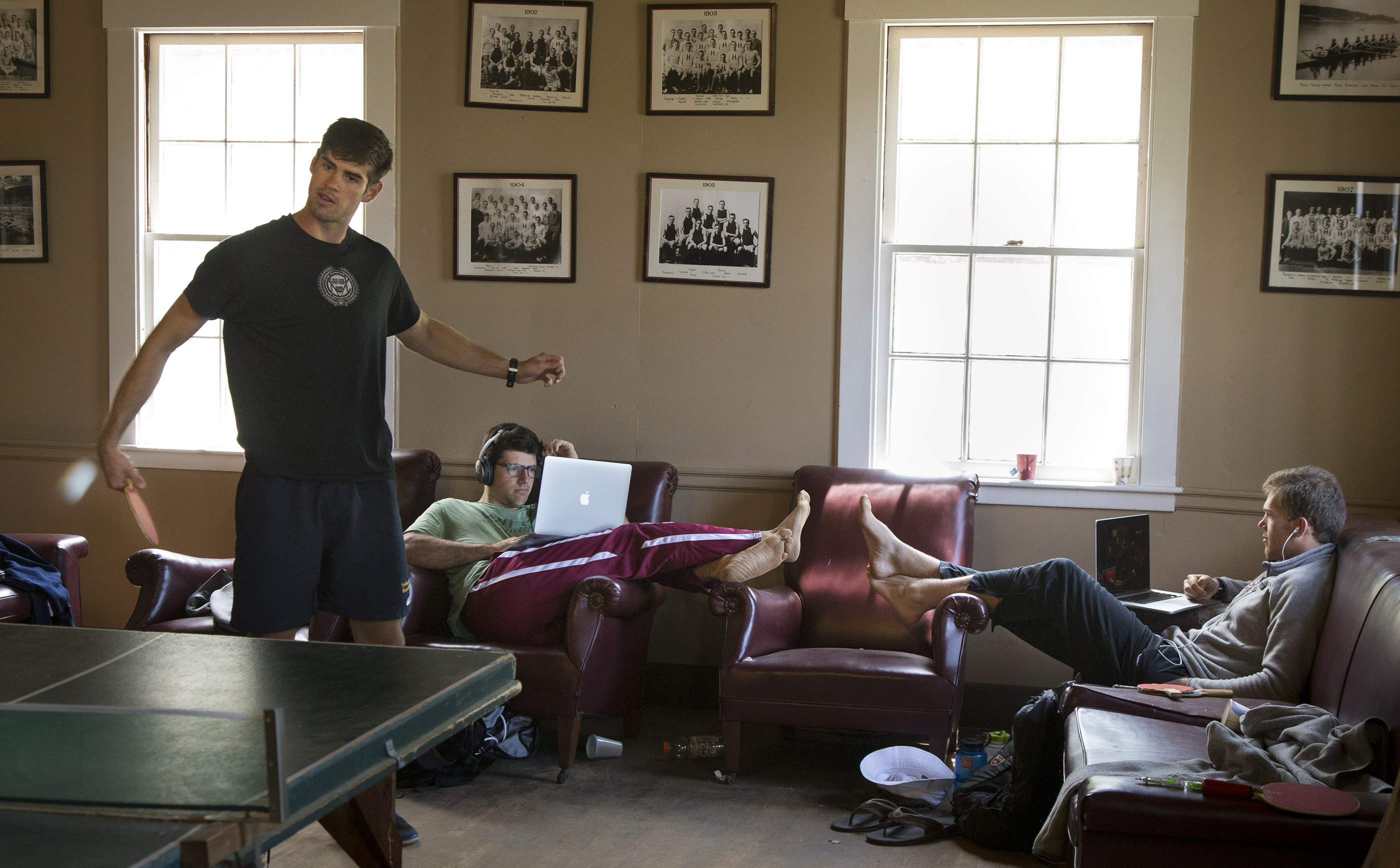 James Medway (left) plays some ping-pong while other team members get some rest during down time in between workouts.