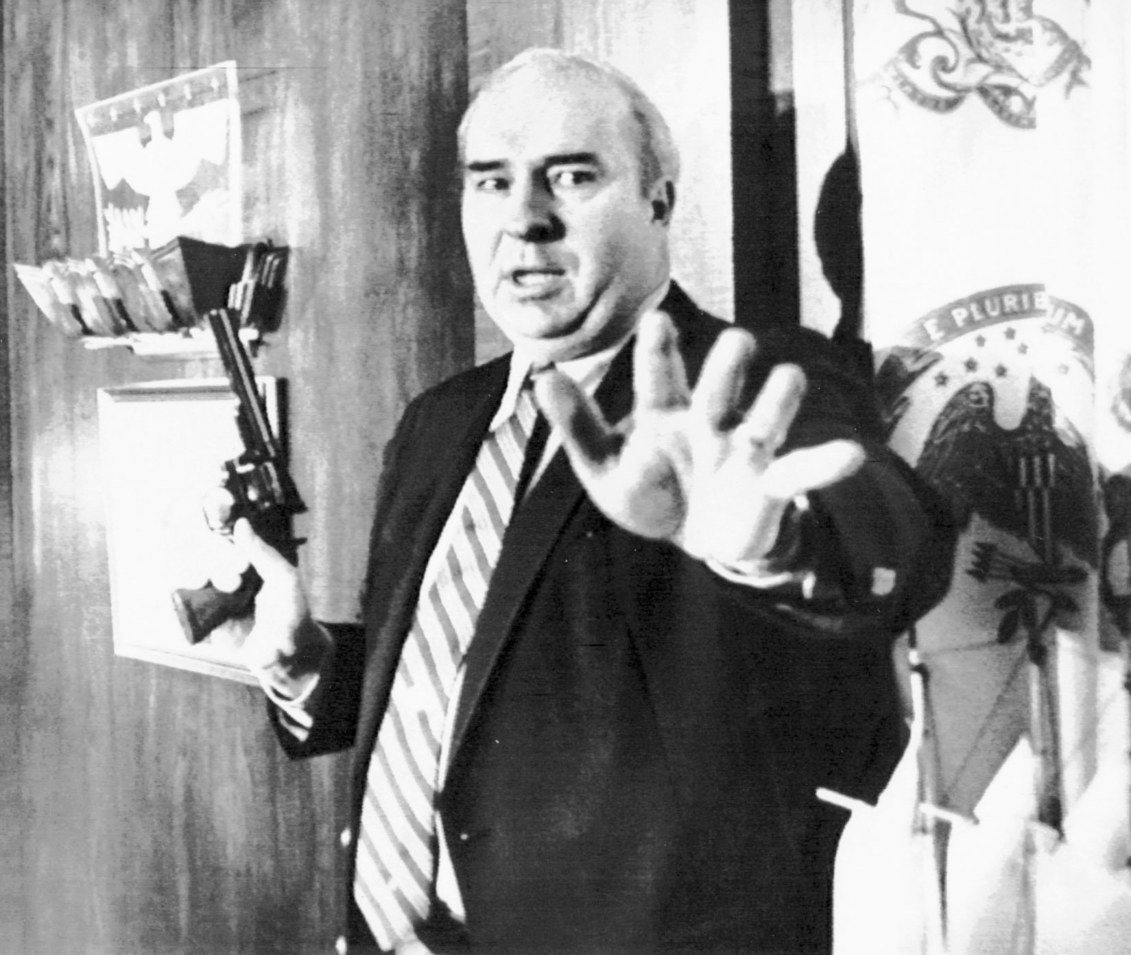 Pennsylvania State Treasurer R. Budd Dwyer held a pistol before he shot and killed himself in front of cameras during a news conference in 1987.