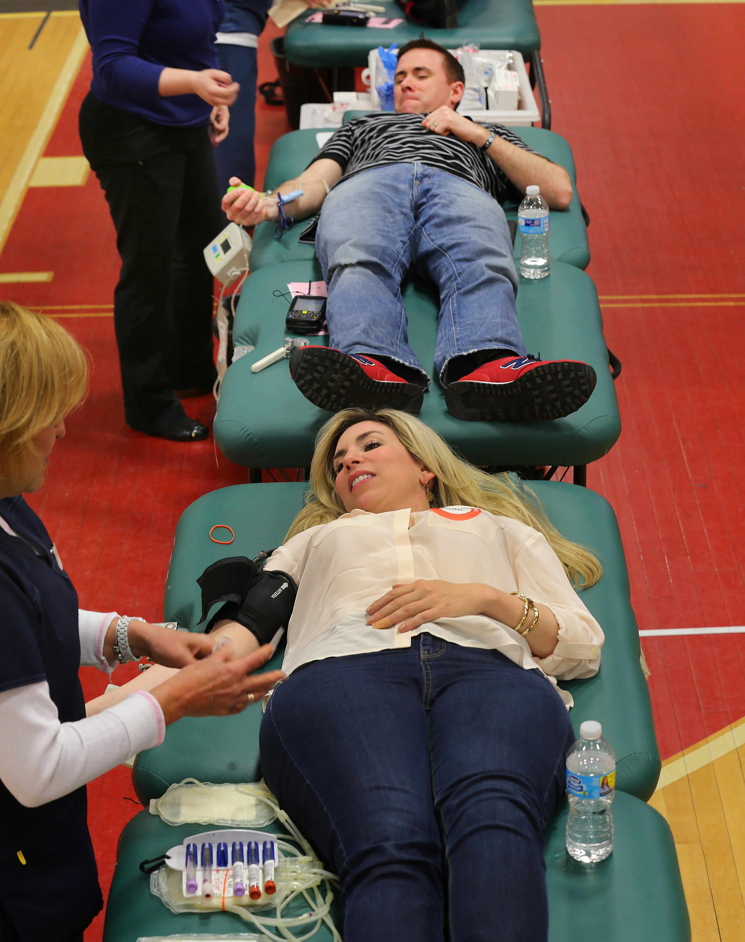 Donohue (top) and Abbott donated blood on Saturday.
