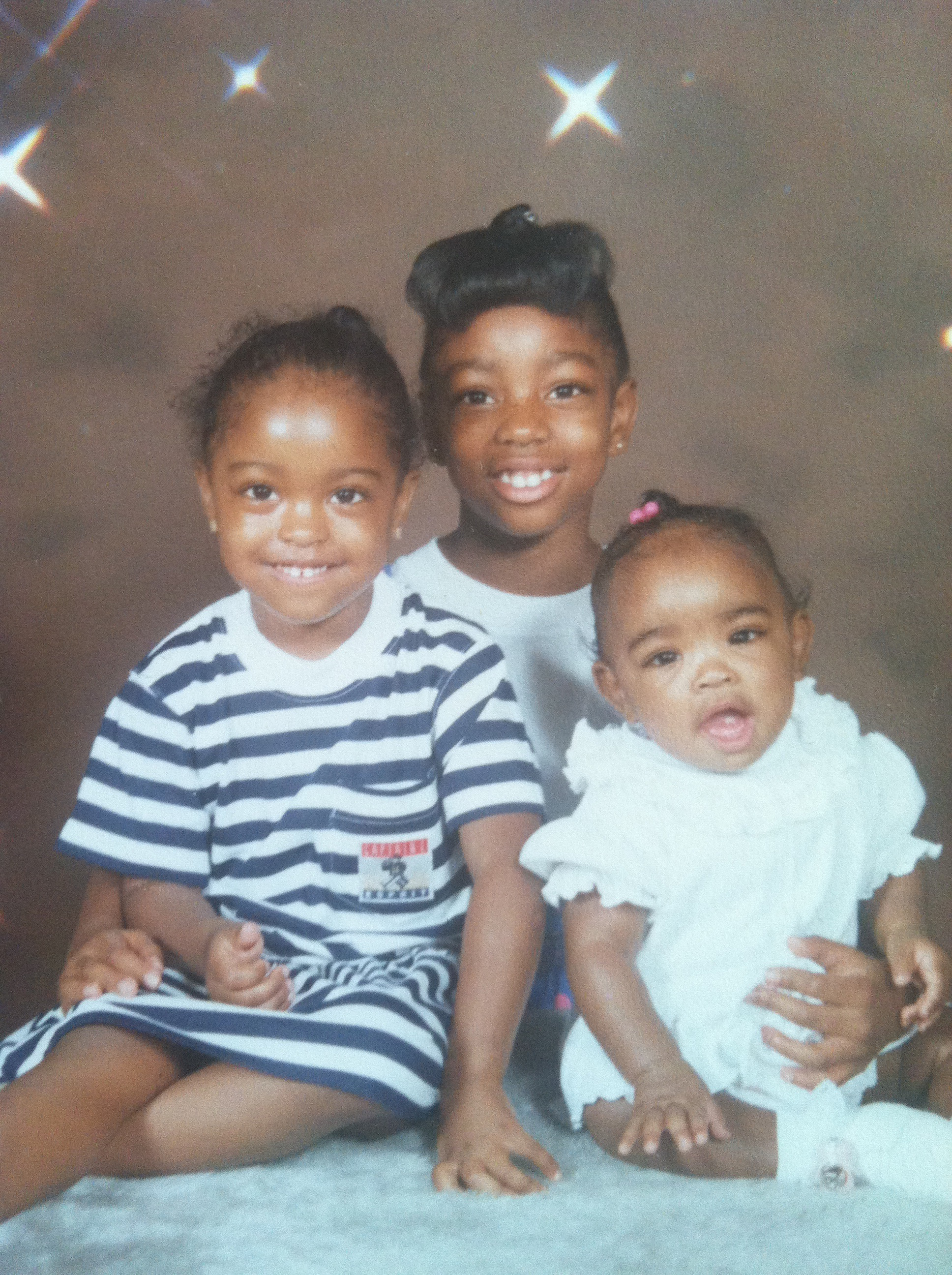 Ebonie Woolcock with her little sisters Yorkela (left) and Lejae (right).