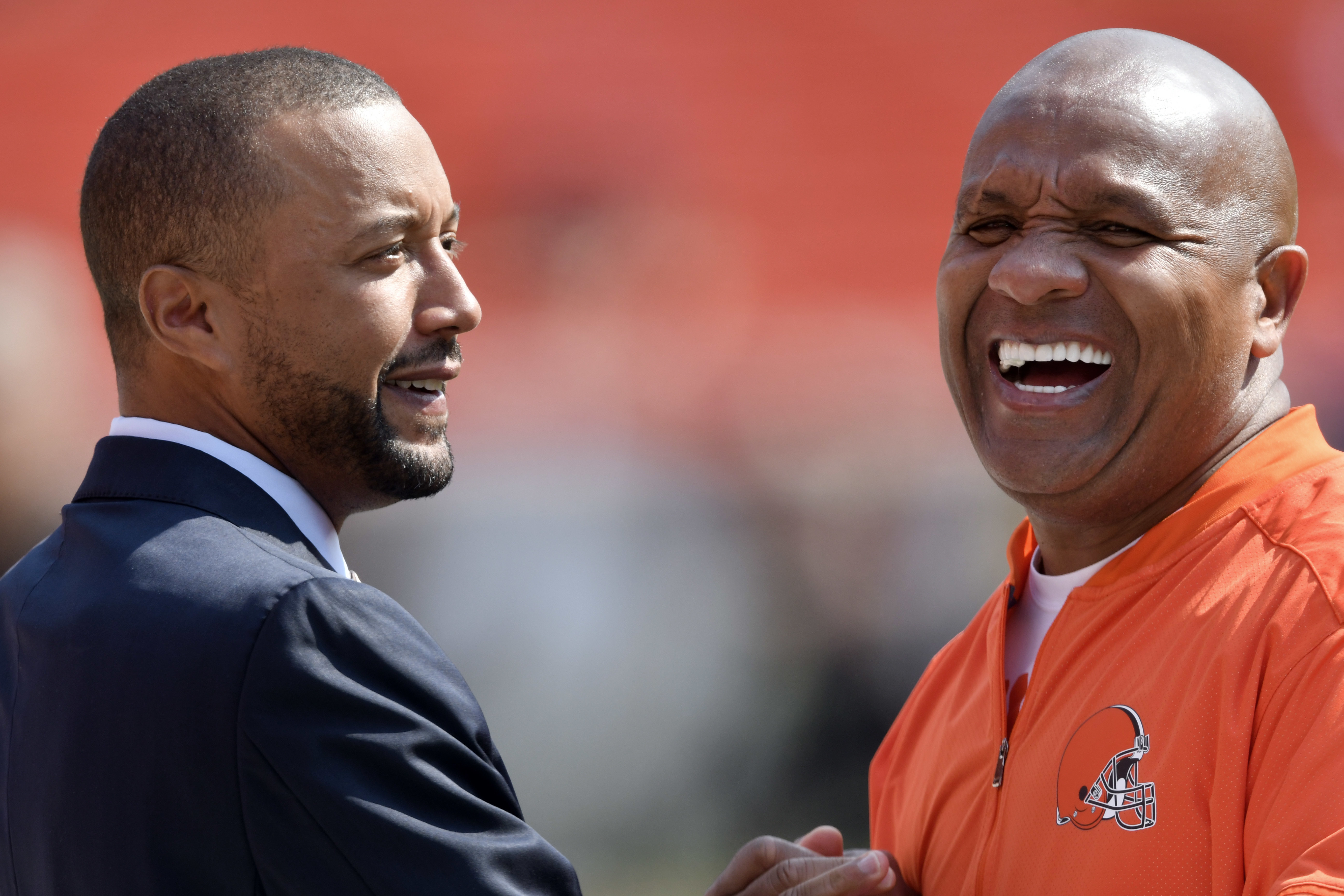 Sashi Brown (left) hasn’t seen eye-to-eye with Hue Jackson (right) on quarterback choices.