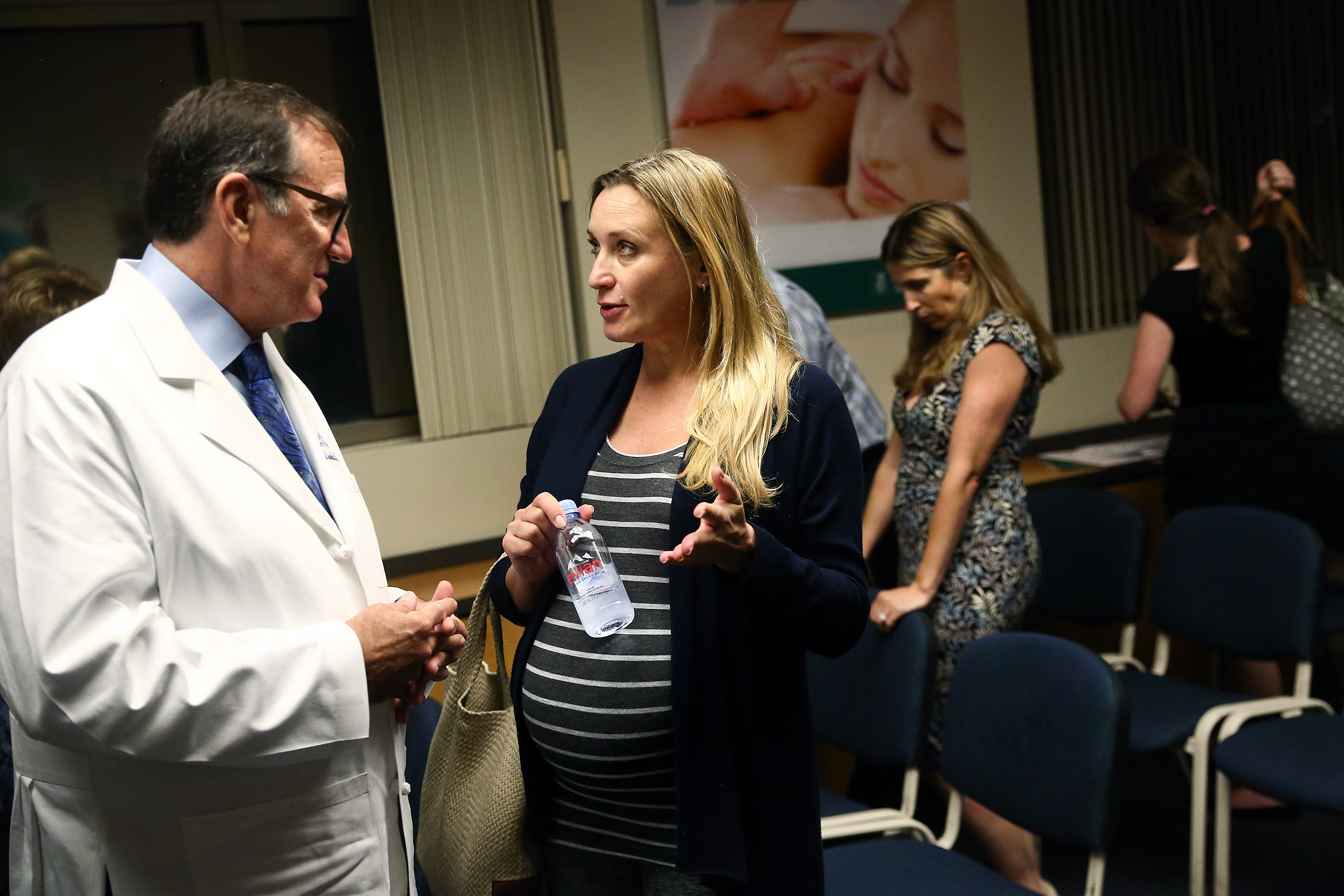 Dr. Michael Jacobs talked with Olena Shcheolrina after a forum about Zika and pregnancy at a Florida hospital.