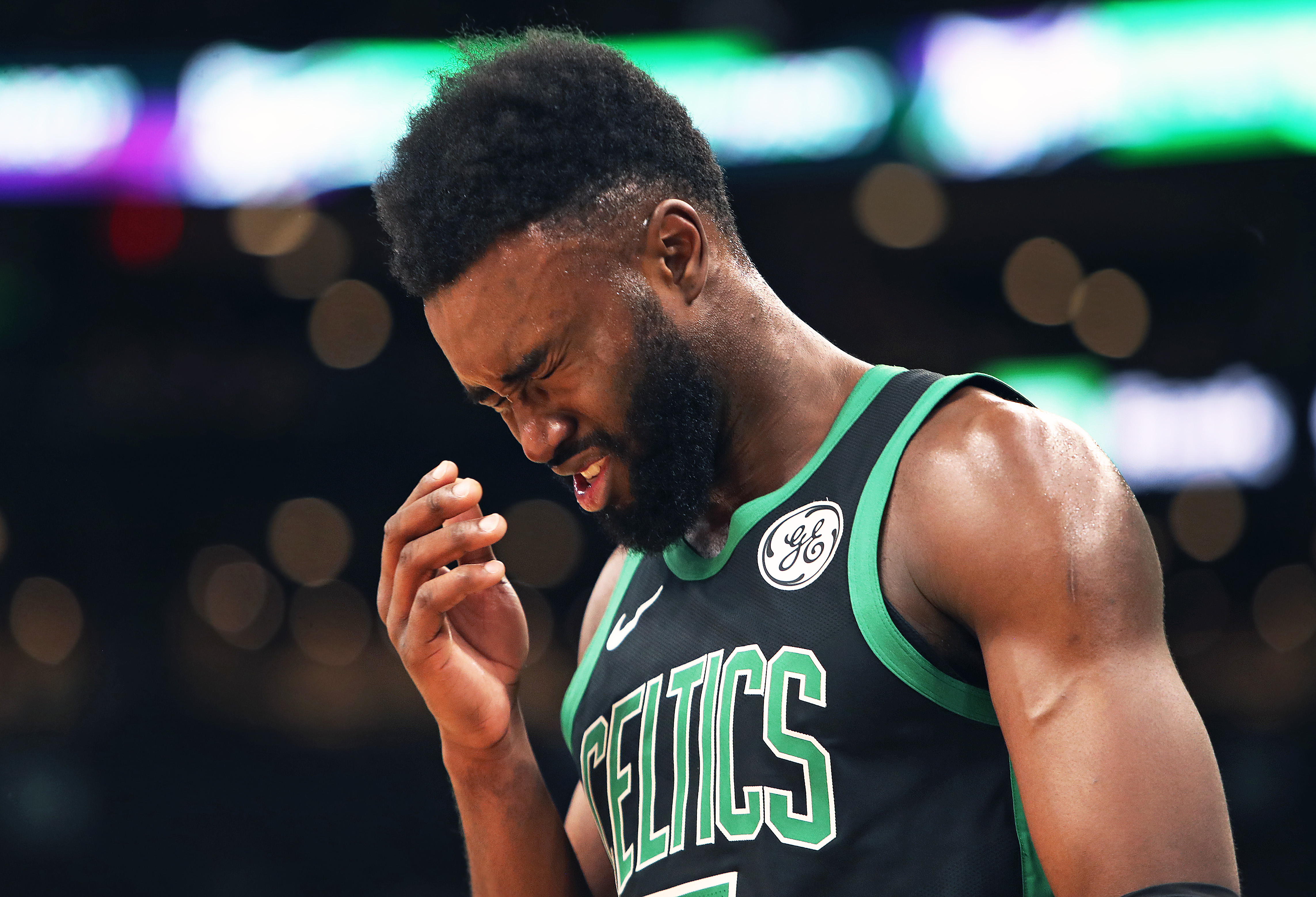 Jaylen Brown grimaces after he was hit in the face accidently by the Spurs LaMarcus Aldridge in the fourth quarter. He left the game and went to the bench to be attended to, then headed for the locker room, done for the night.
