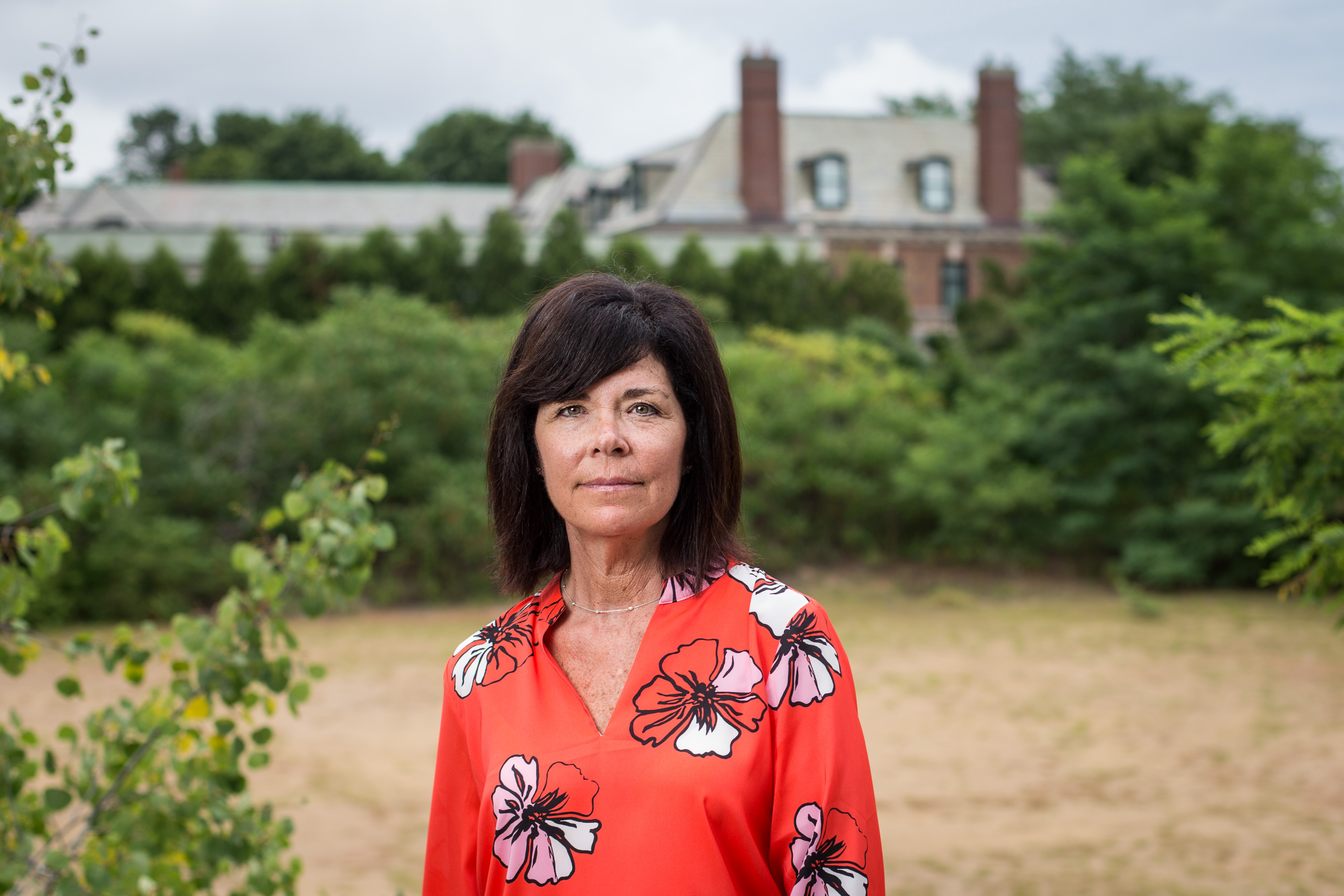 Lorena Wile on the Beverly property, which now primarily belongs to her, with the Horvitz home in the background.
