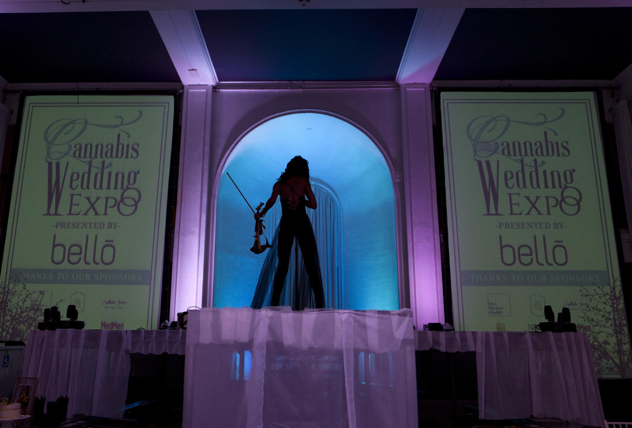 Violinist Crissy J plays on stage.
