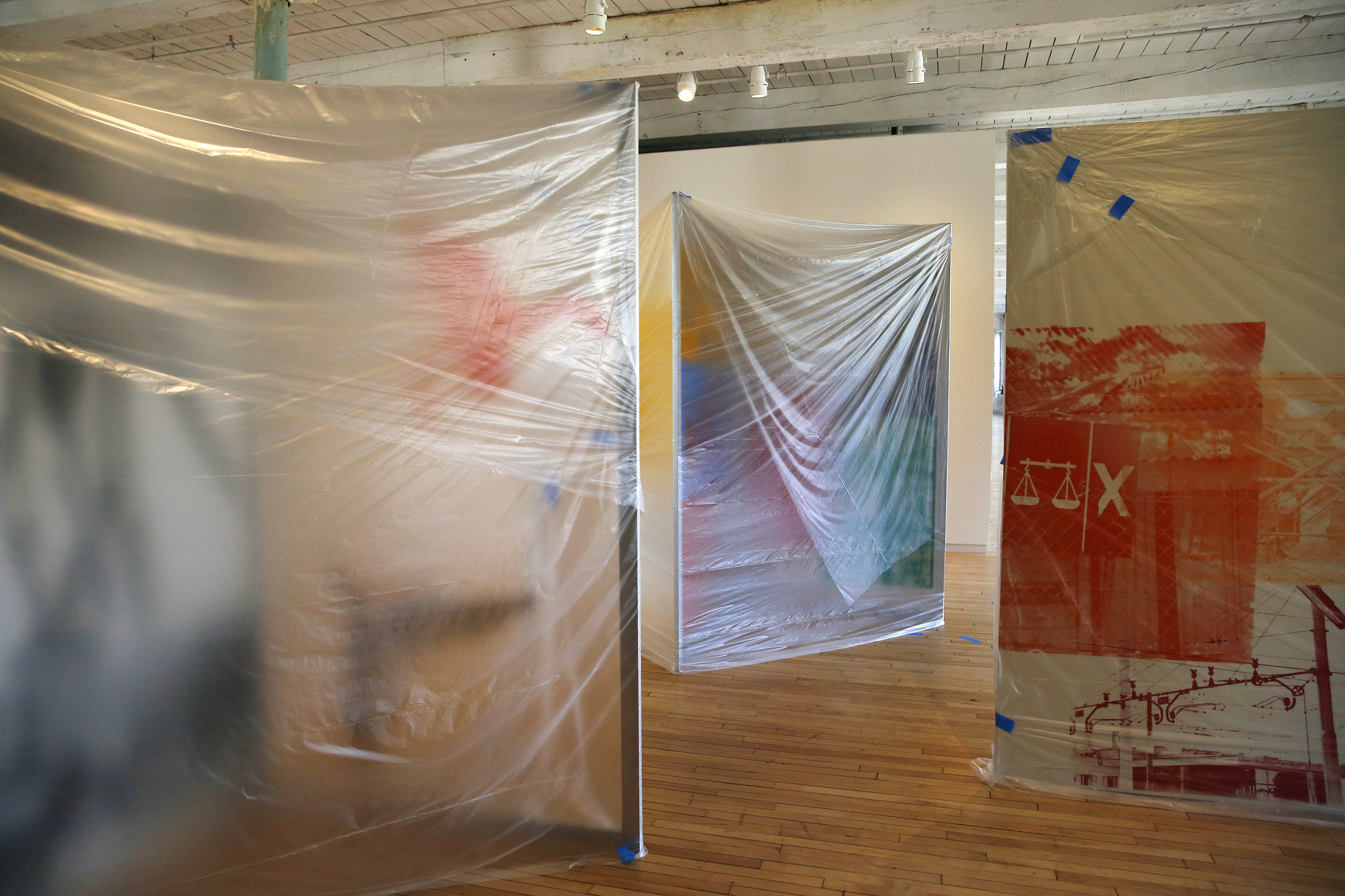 Pieces by Robert Rauschenberg are covered inside Building 6 at the Massachusetts Museum of Contemporary Art.