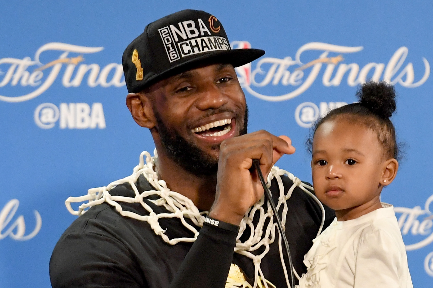 James held his daughter Zhuri during the postgame news conference.