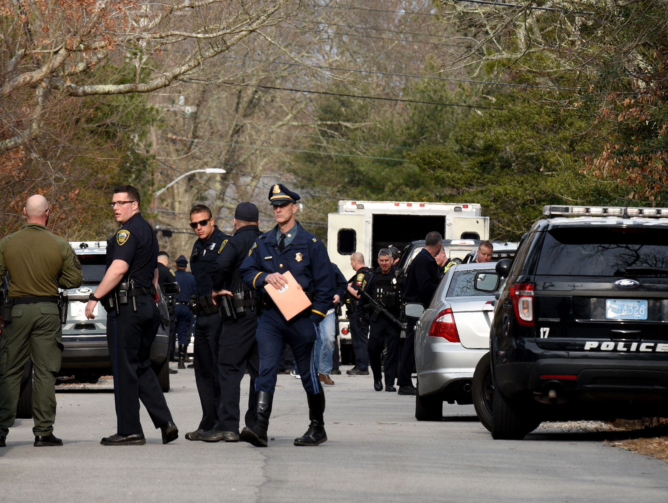 Police officers on the scene in the area of Lakeside Drive in Marstons Mills on Thursday.