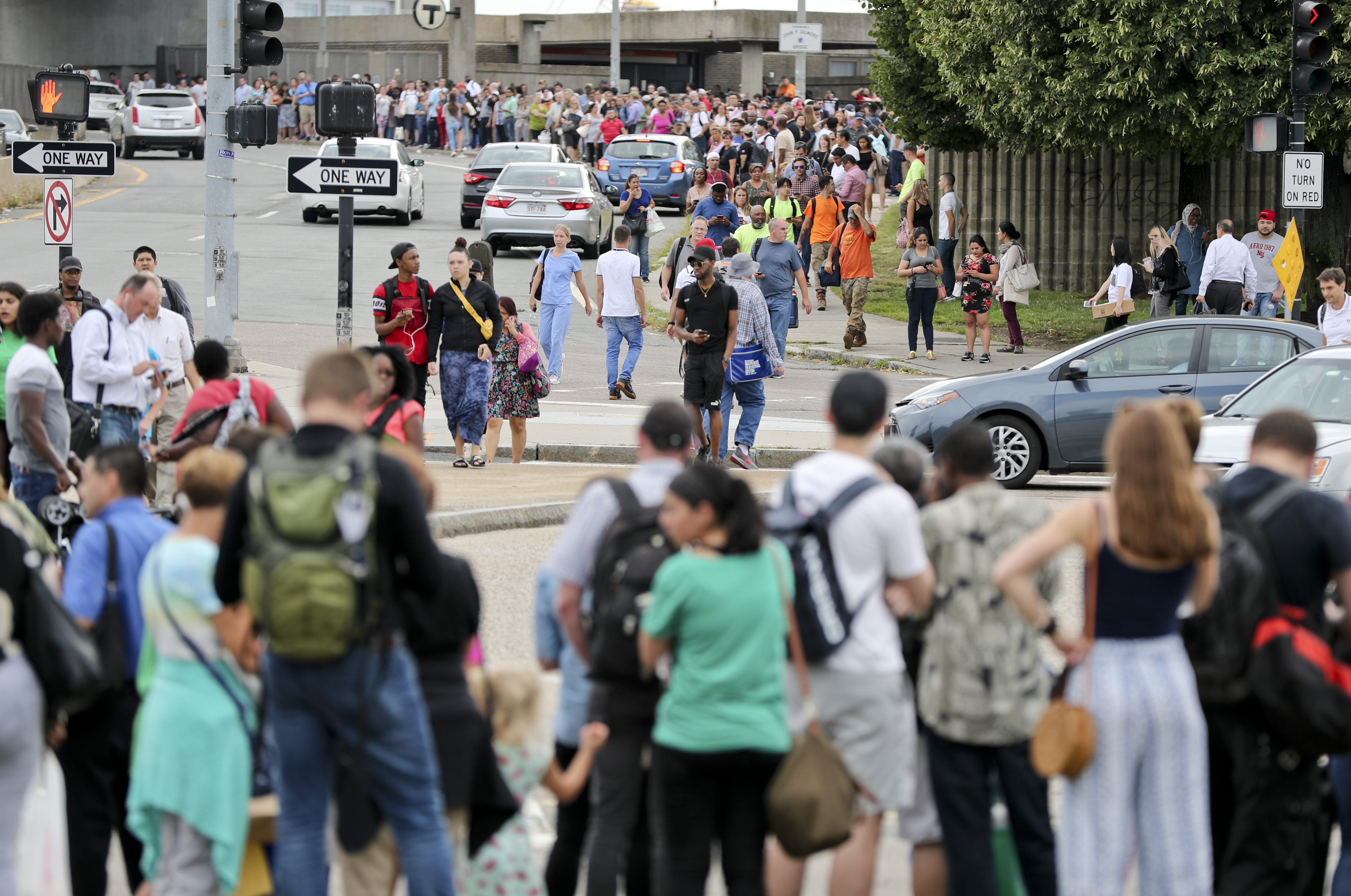 Orange Line riders waited for shuttle buses near Community College Station on Friday.