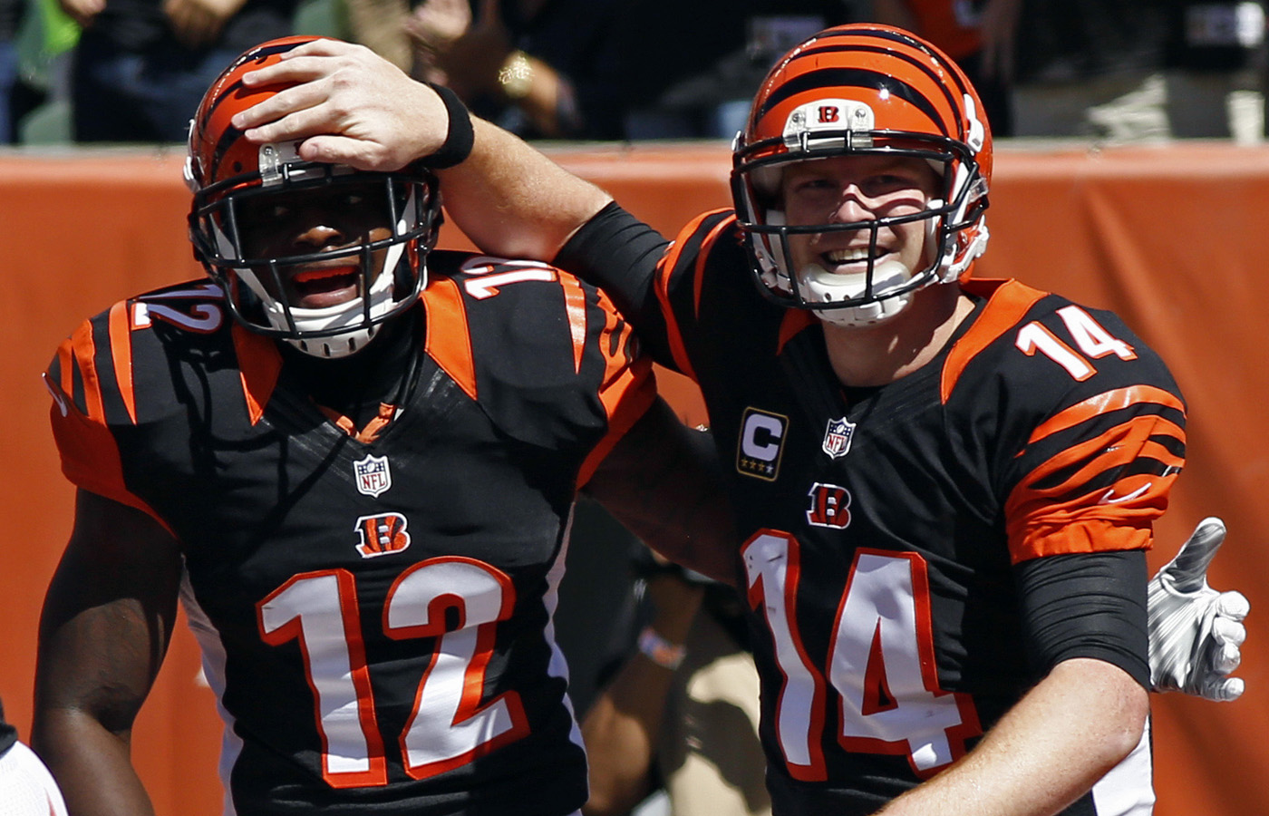 Sanu celebrated with Bengals quarterback Andy Dalton after a touchdown pass against the Titans in 2014.