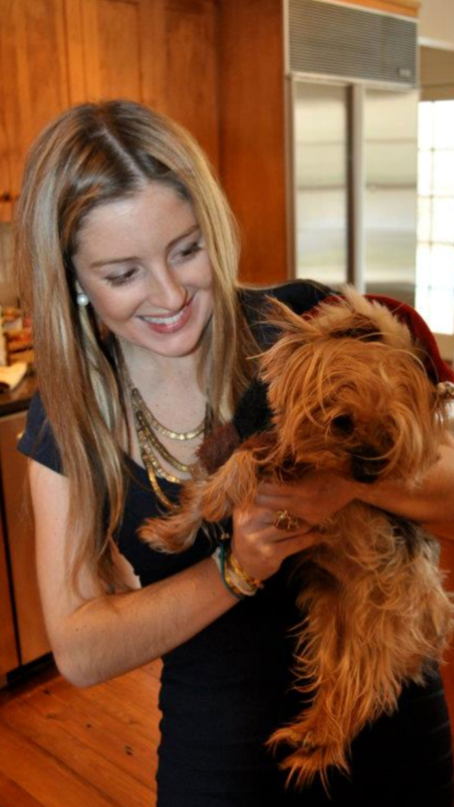 Caitlin O’Hara, pictured with her dog during Christmas 2012, was “even more beautiful on the inside,” her father said.