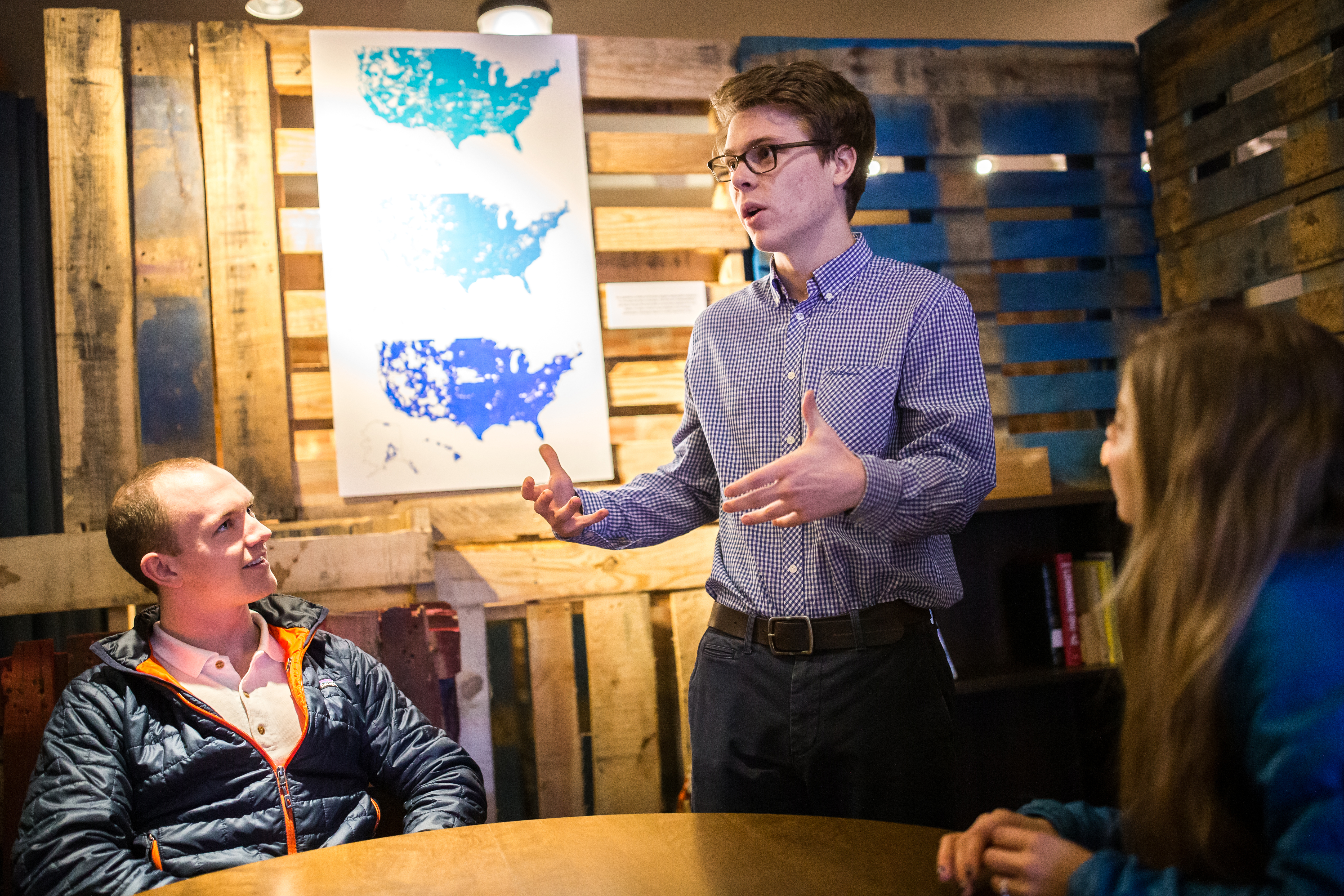 Co-founder John LaGue (left), Founder James Graham (center), and Director of Marketing Ellie Lasater-Guttmann at Community Phone in Cambridge.