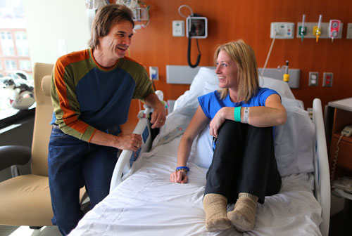 Globe photographer John Tlumacki met Marathon bombing survivor Nicole Gross in her hospital room on Friday.
