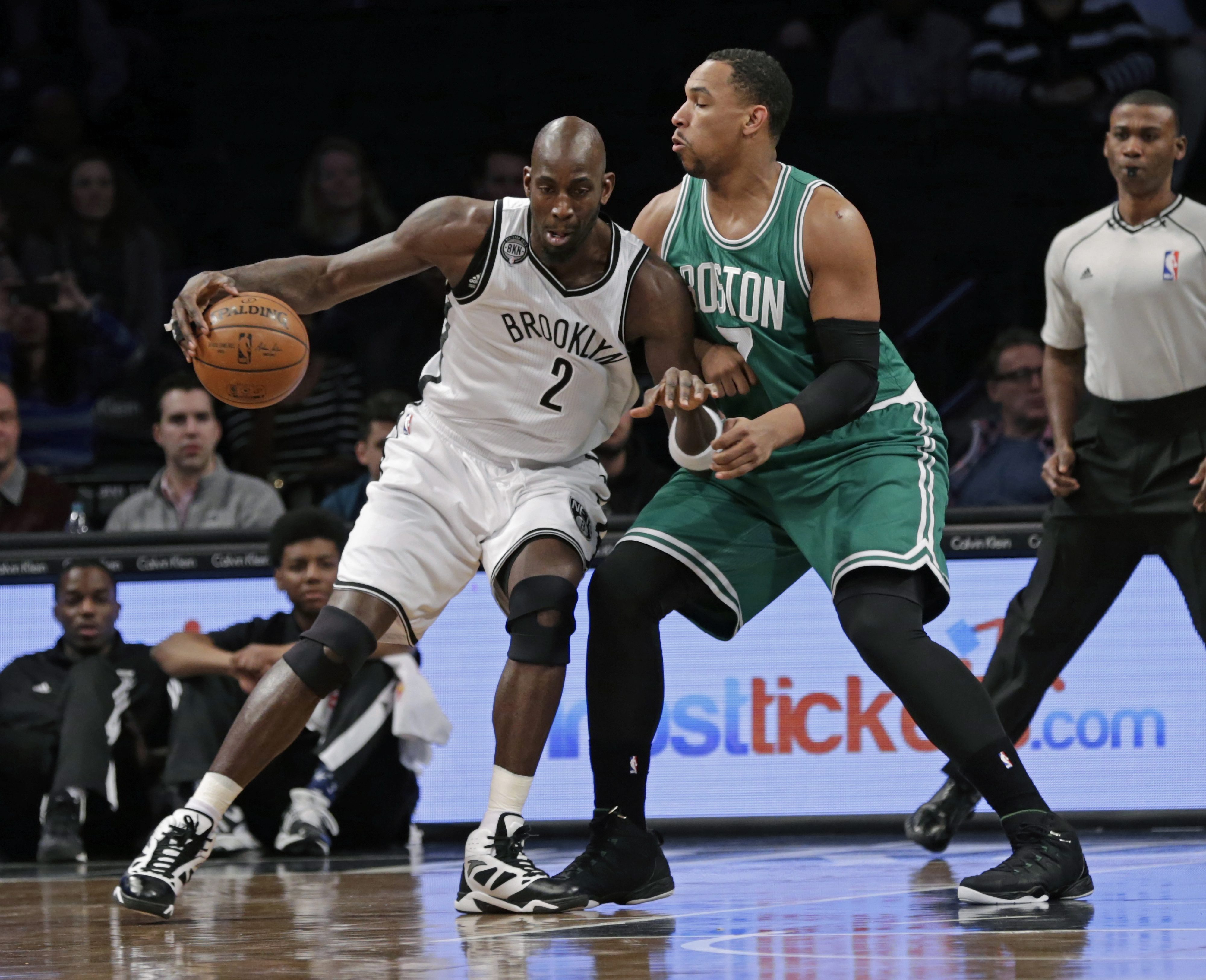 Nets forward Kevin Garnett tries to work his way past Celtics’ big man Jared Sullinger.