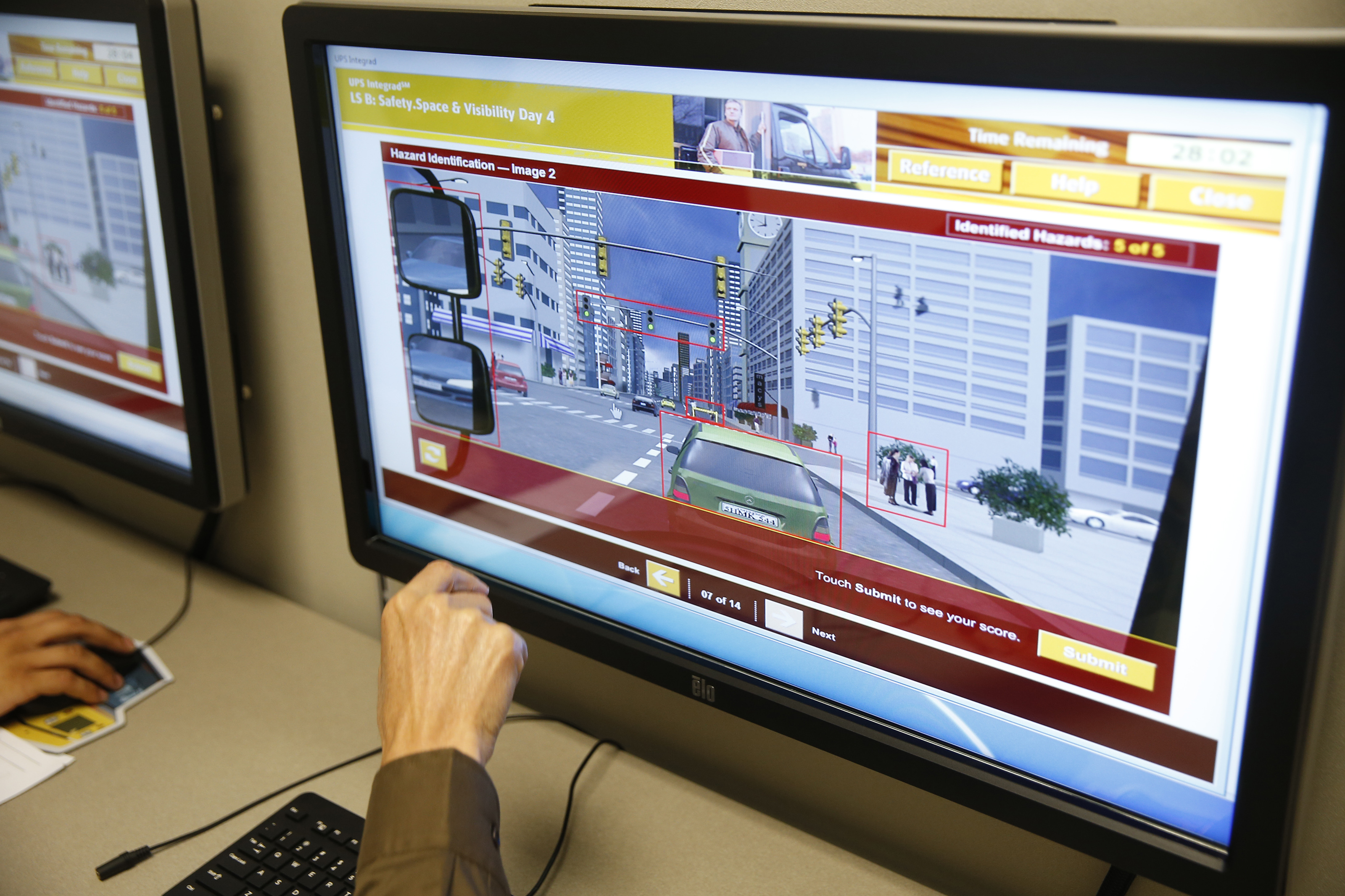 At the Hazard Identification station, UPS recruits try to pick out dangers they might face on the road.