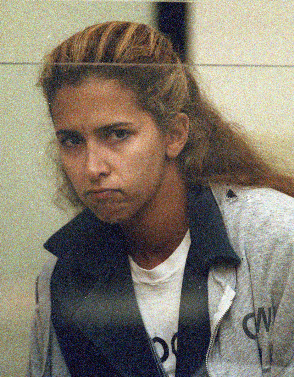 Says Naposki of Nanette Johnston, shown at an arraignment in the 1990s: “All that I am guilty of is having the wrong girlfriend. She threw me under the bus.’’