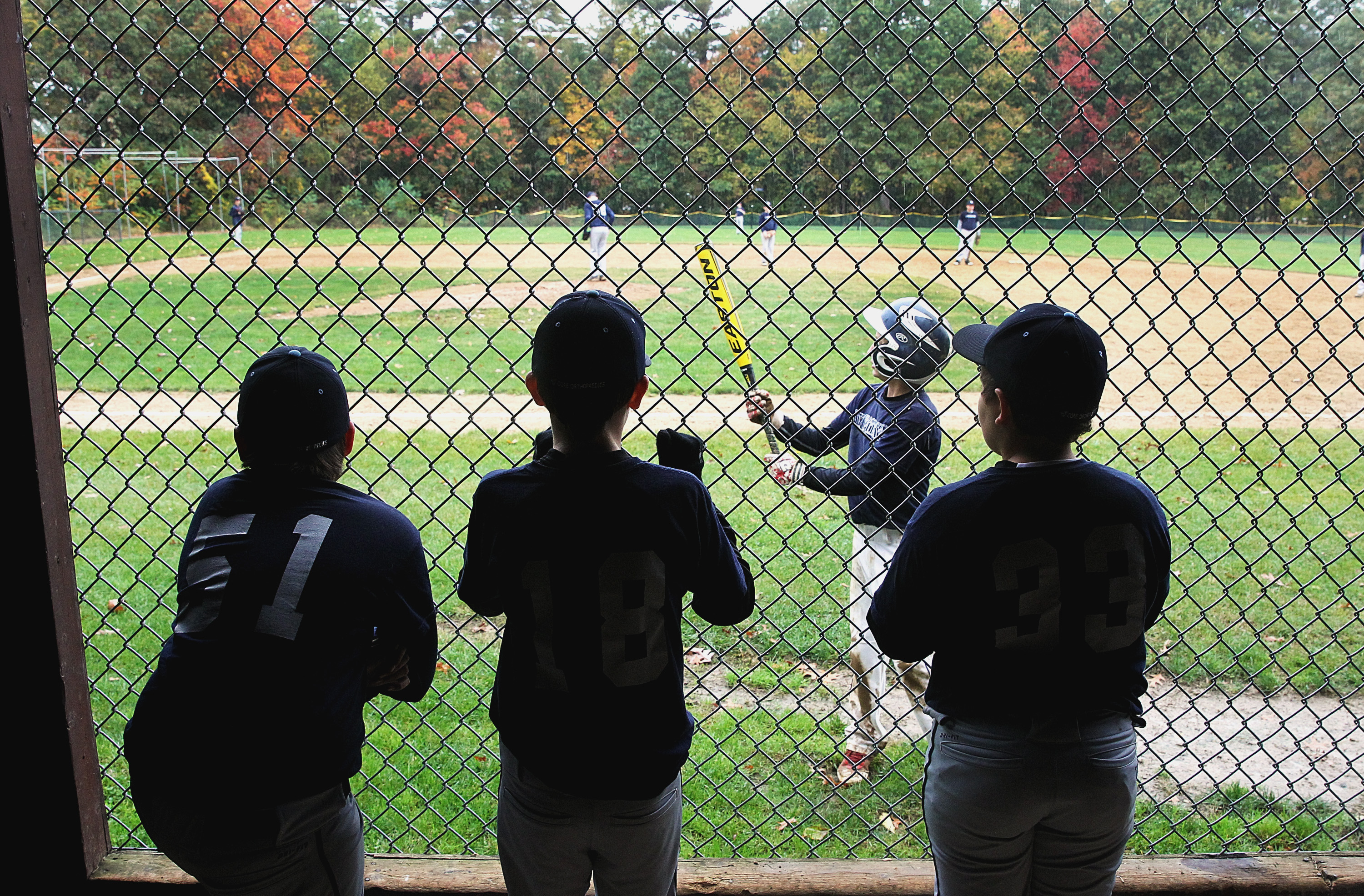 Seacoast United Navy members watch from the dugout during a game earlier this month against Seacoast United Carolina in Stratham, N.H.