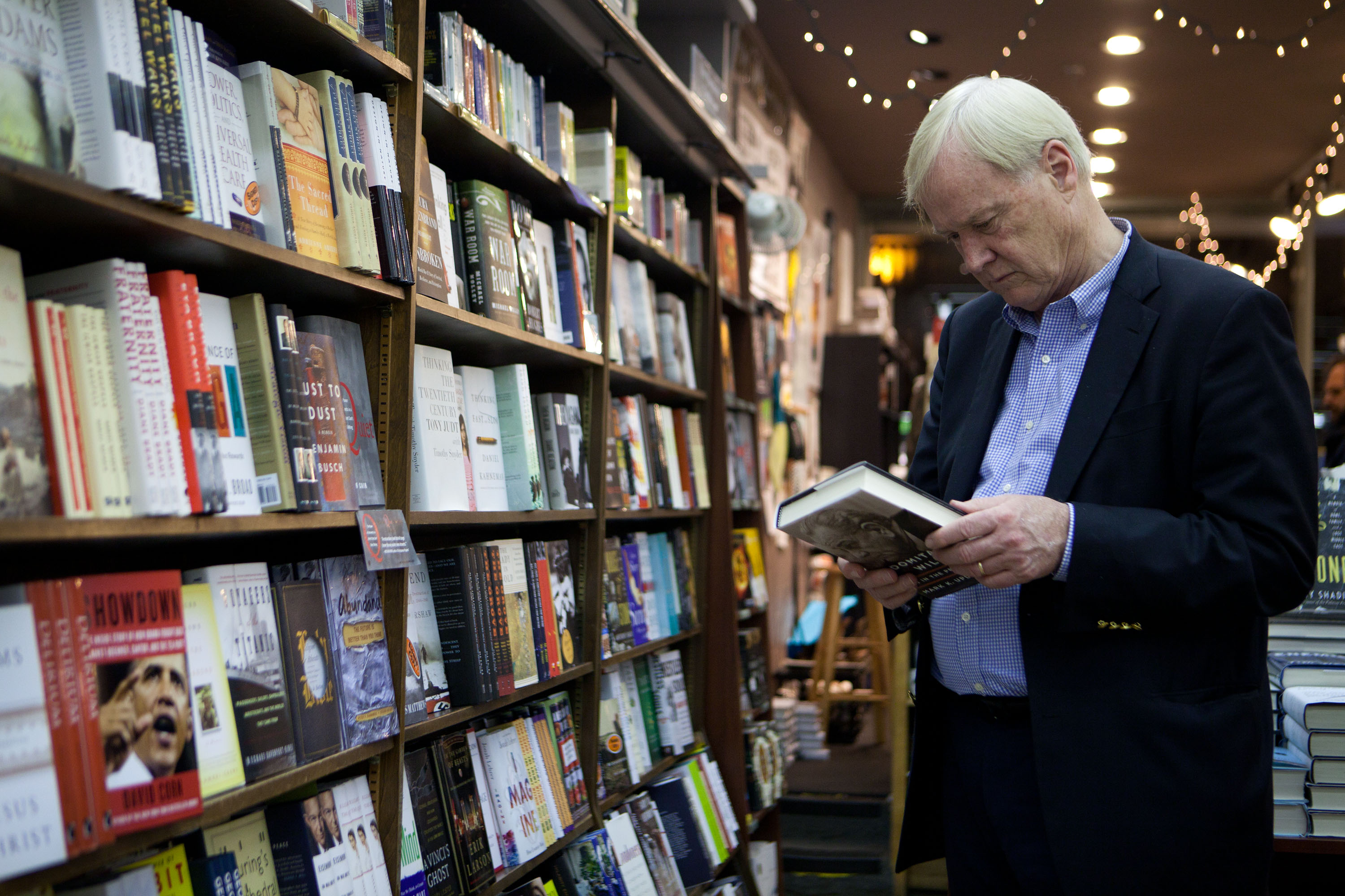 Chris Matthews, author of "Jack Kennedy," browses for books after speaking at an author appearance event at the Brookline Booksmith.