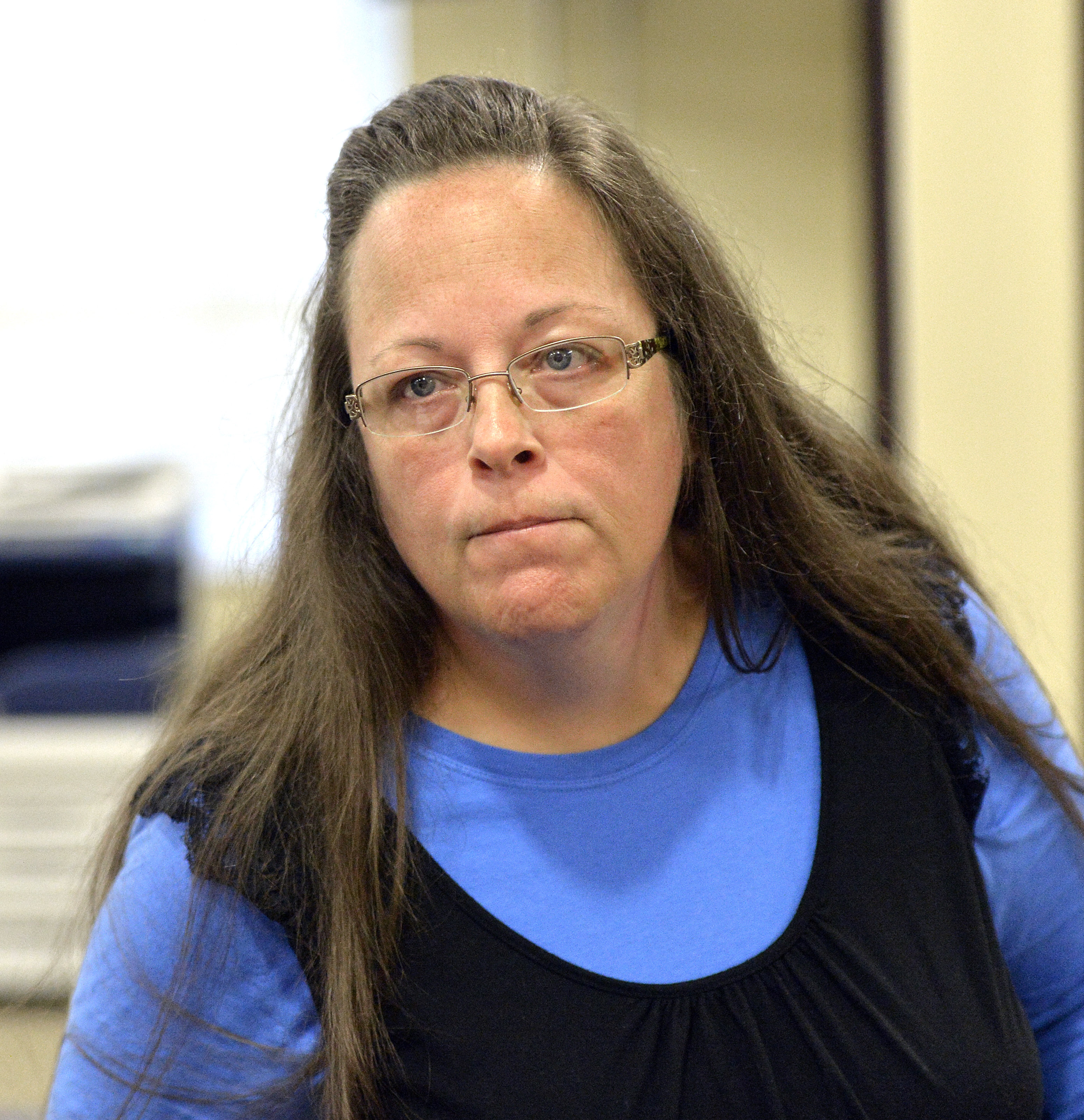 Rowan County Clerk Kim Davis listened to a customer following her office’s refusal to issue marriage licenses at the Rowan County Courthouse in Morehead, Ky., on Tuesday.