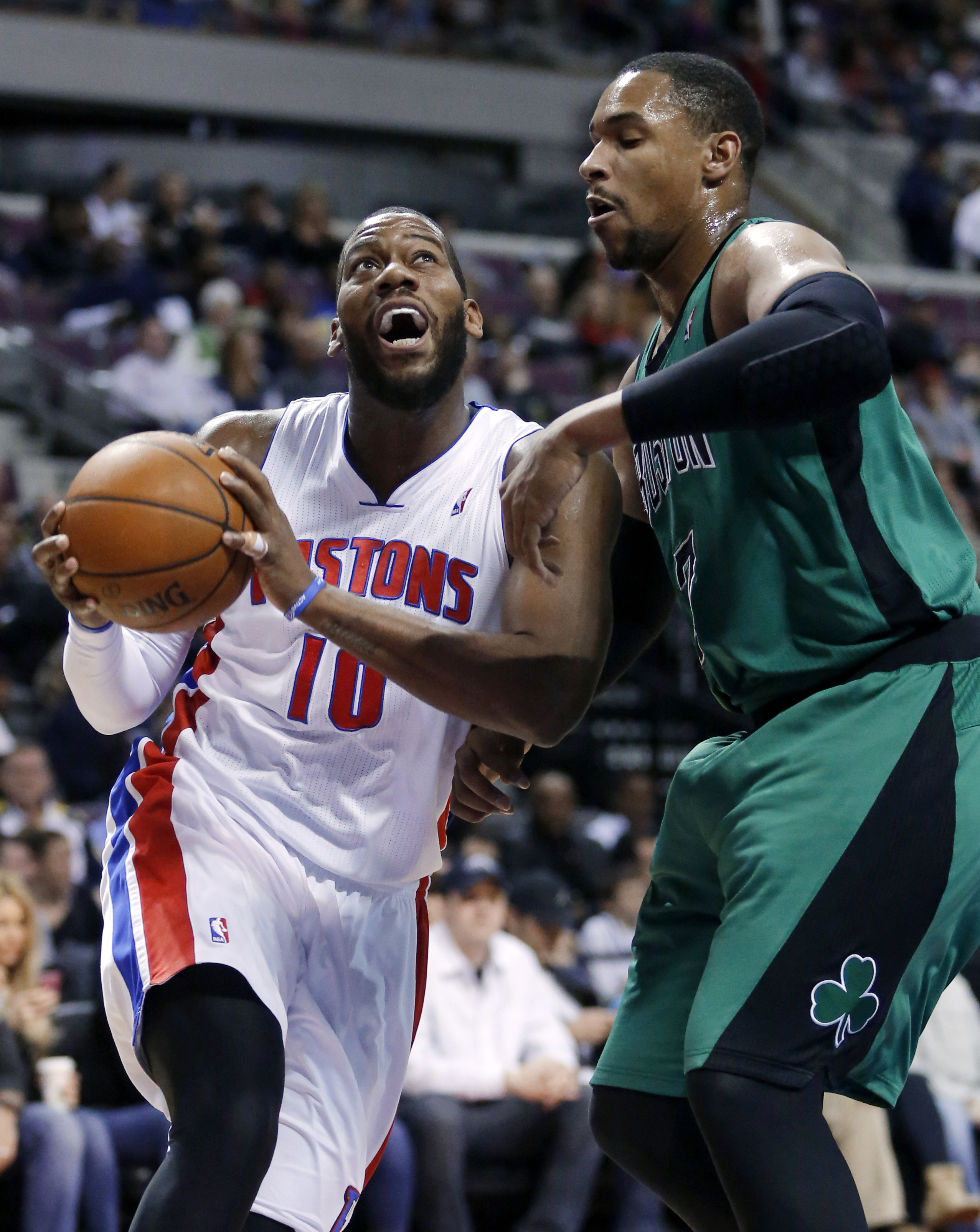 Pistons center Greg Monroe (10) drove against Celtics forward Jared Sullinger during the first half.
