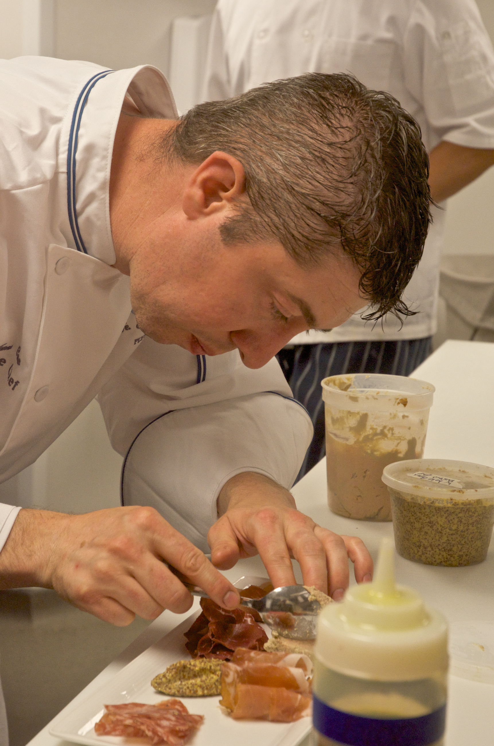 Executive chef Stephen Coe at work in the Inn’s kitchen for the restaurant Henri-Marie.
