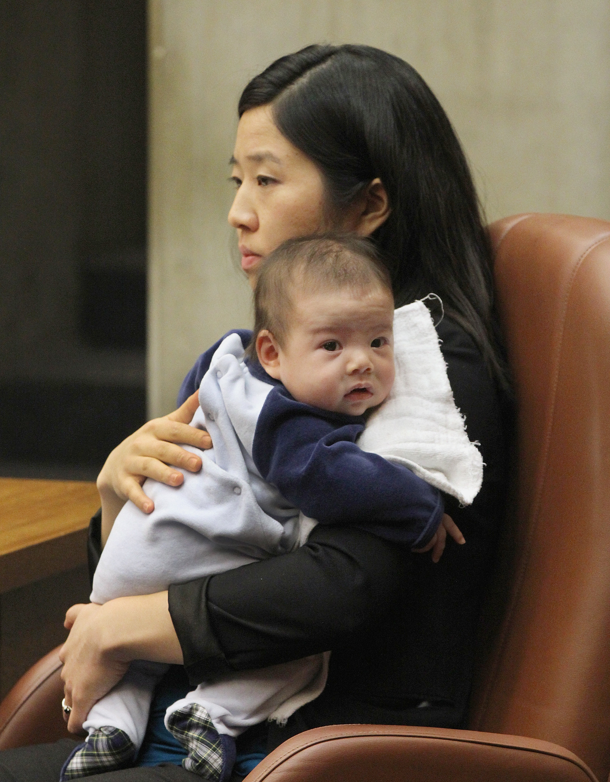 Boston City Councilor Michelle Wu held her 11-week-old son during a hearing on Boston’s Olympics bid on March 6.
