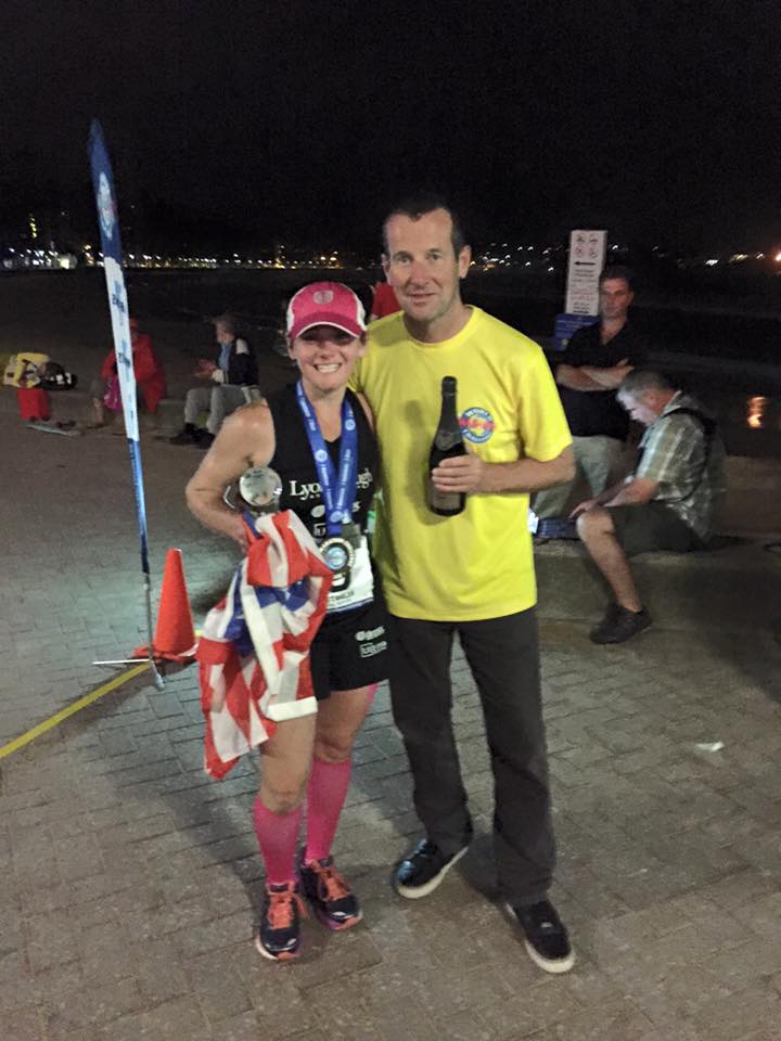 Becca Pizzi won the final women’s race in 4:08:51 hours. She stood at the finish line with event director Richard Donovan.