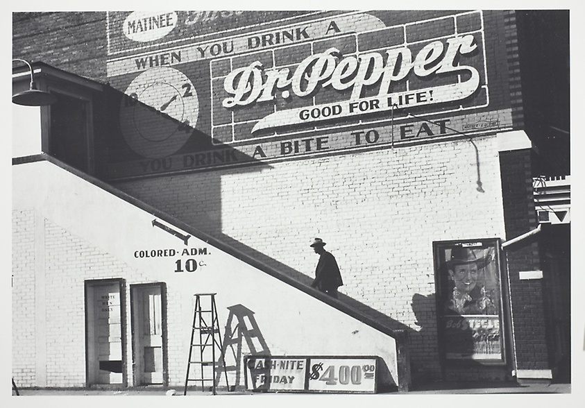 Marion Post Wolcott's "Negro man entering a movie theatre by outside stairway 'For Colored Only' in the Delta area, Belzoni, Mississippi," 1939.