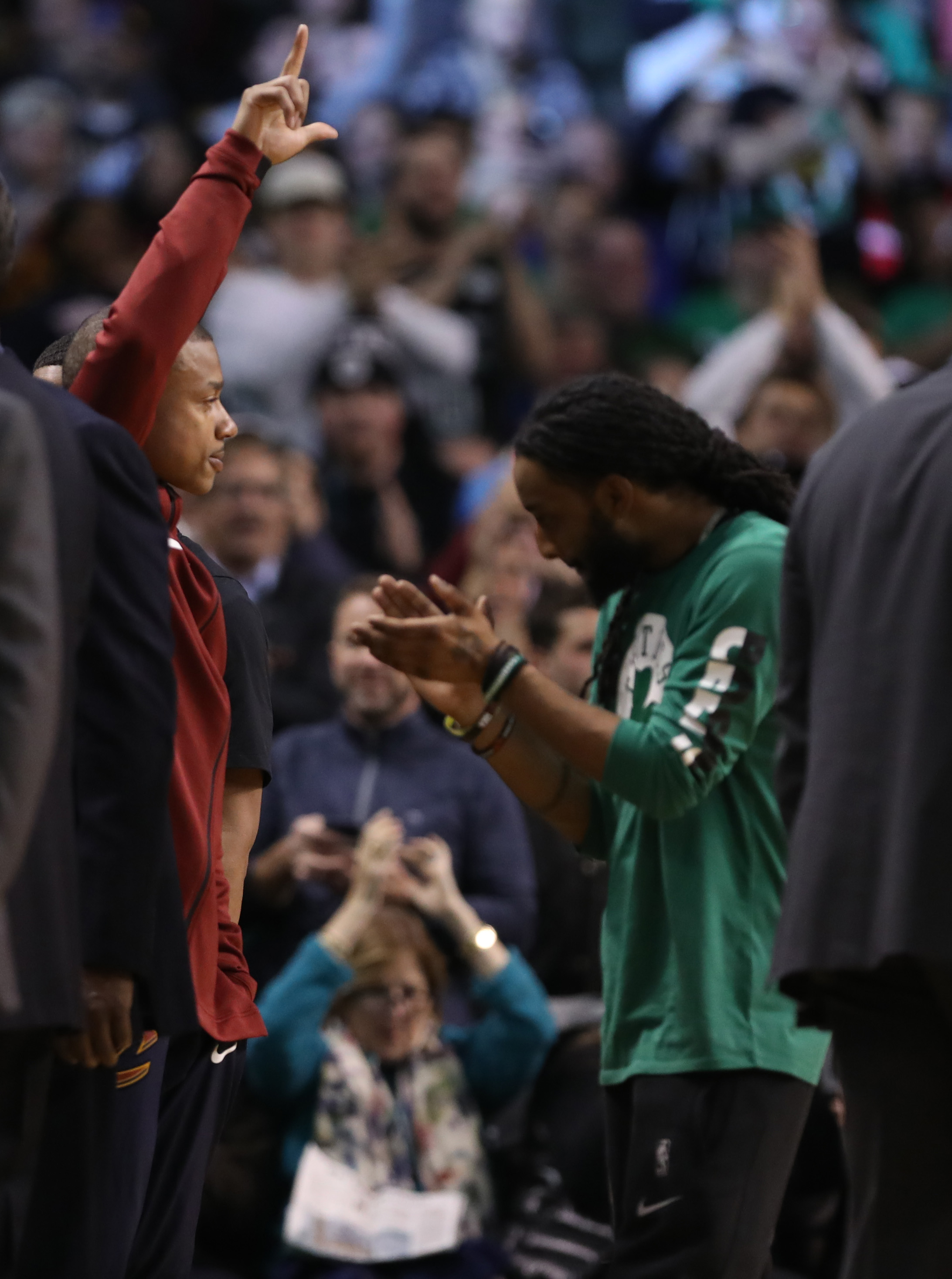 Isaiah Thomas (left) responded to cheers when fans spotted him on the Garden scoreboard.