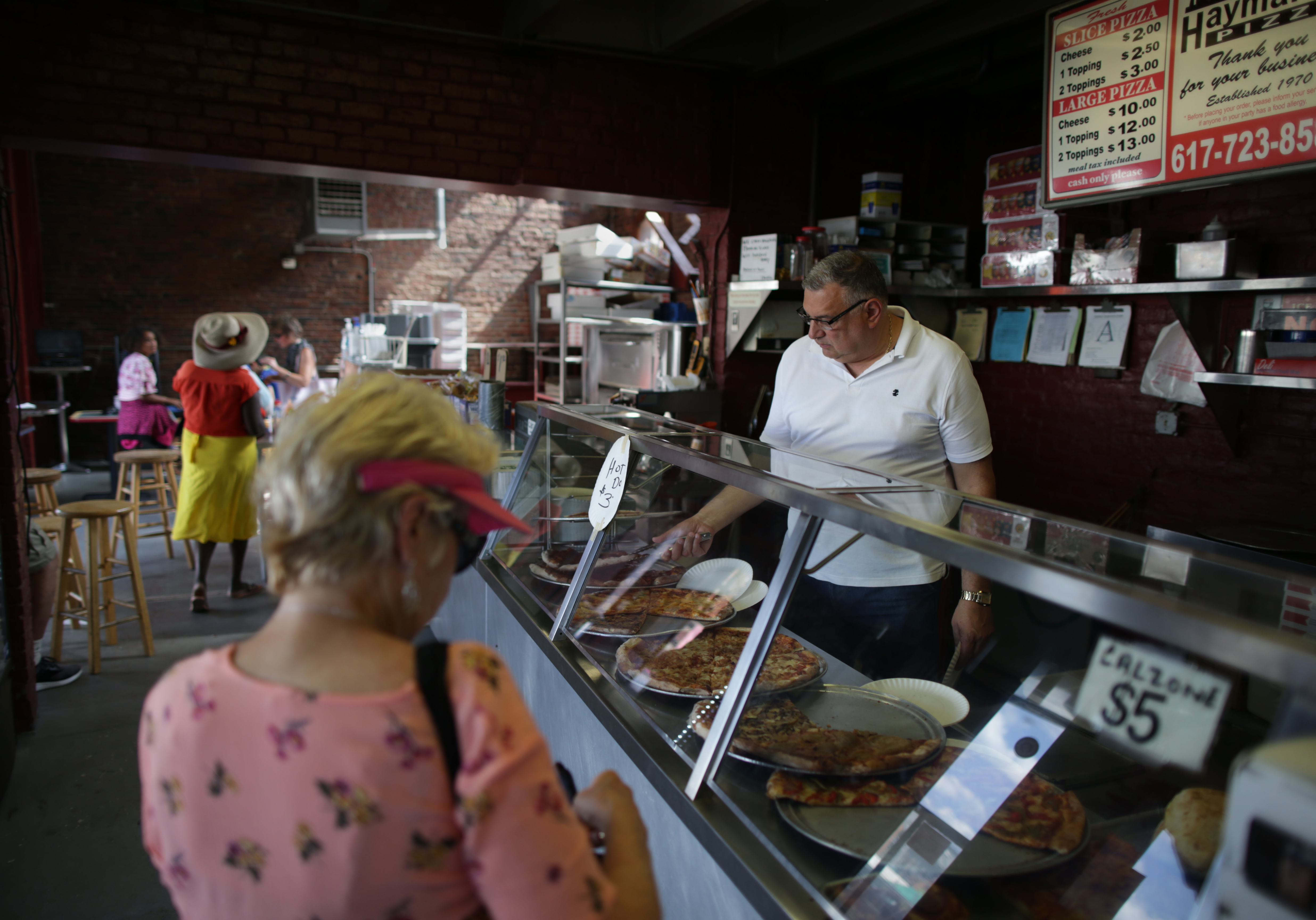 Al Sciola said that he had put his savings into keeping his Haymarket Pizza shop afloat.