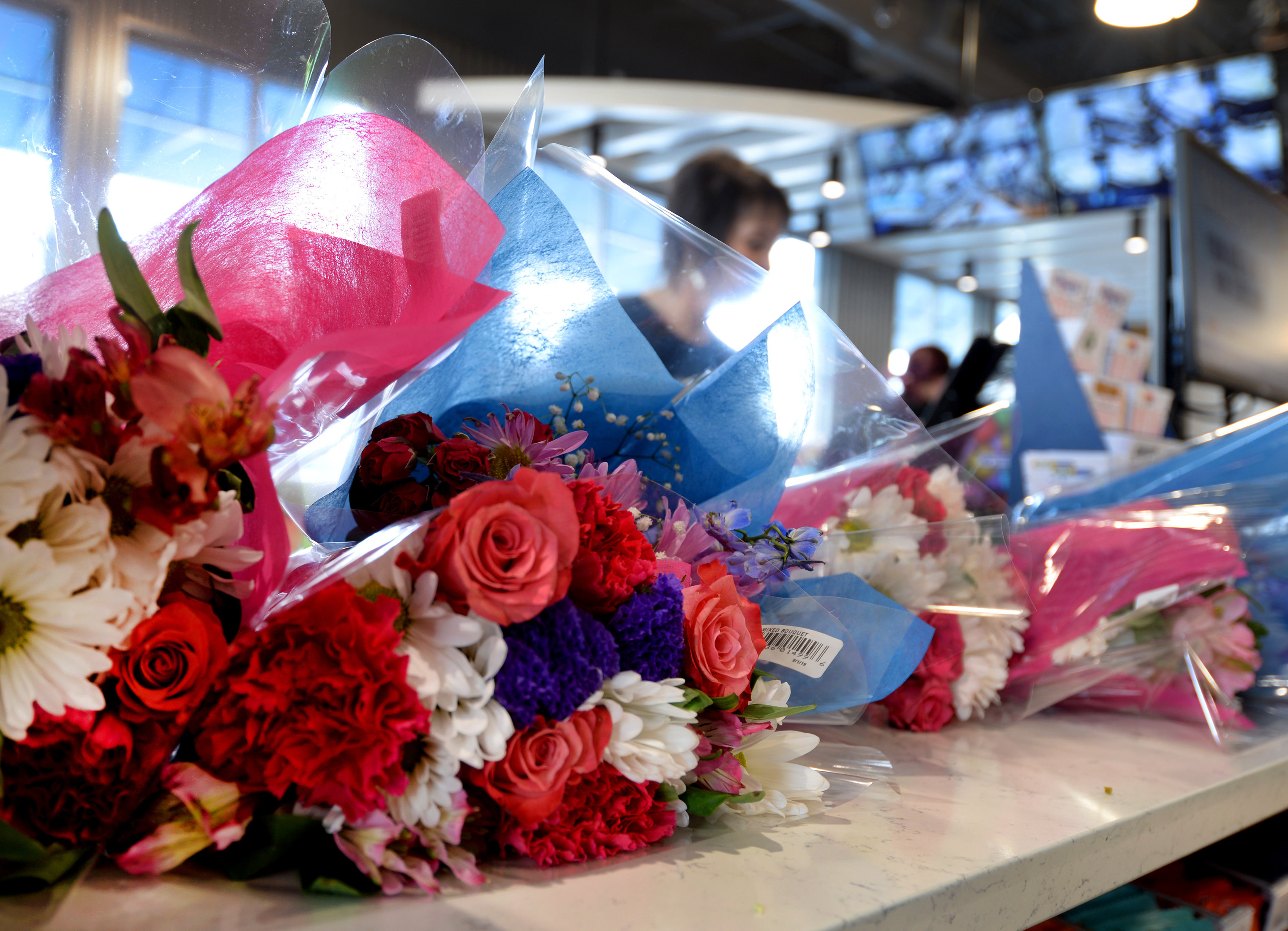 Bouquets of flowers lined the counter at the Alltown Fresh gas station and convenience store in Plymouth.