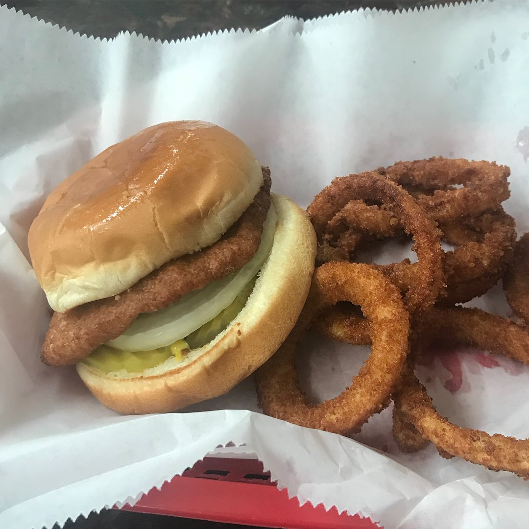 A slugburger served with onion rings.