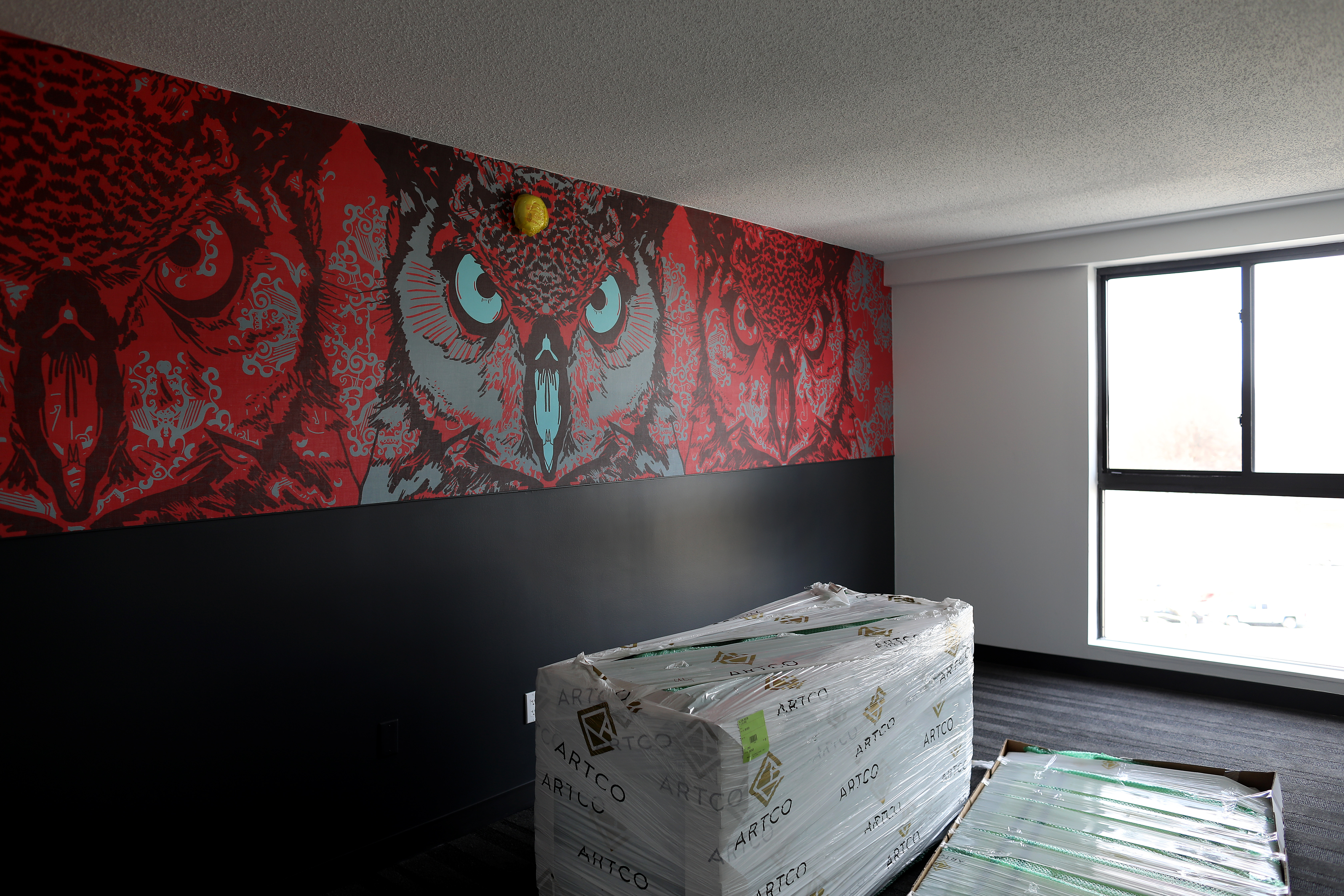 A big owl by Jay LaCouture is a hallmark of one of the rooms of Studio Allston.