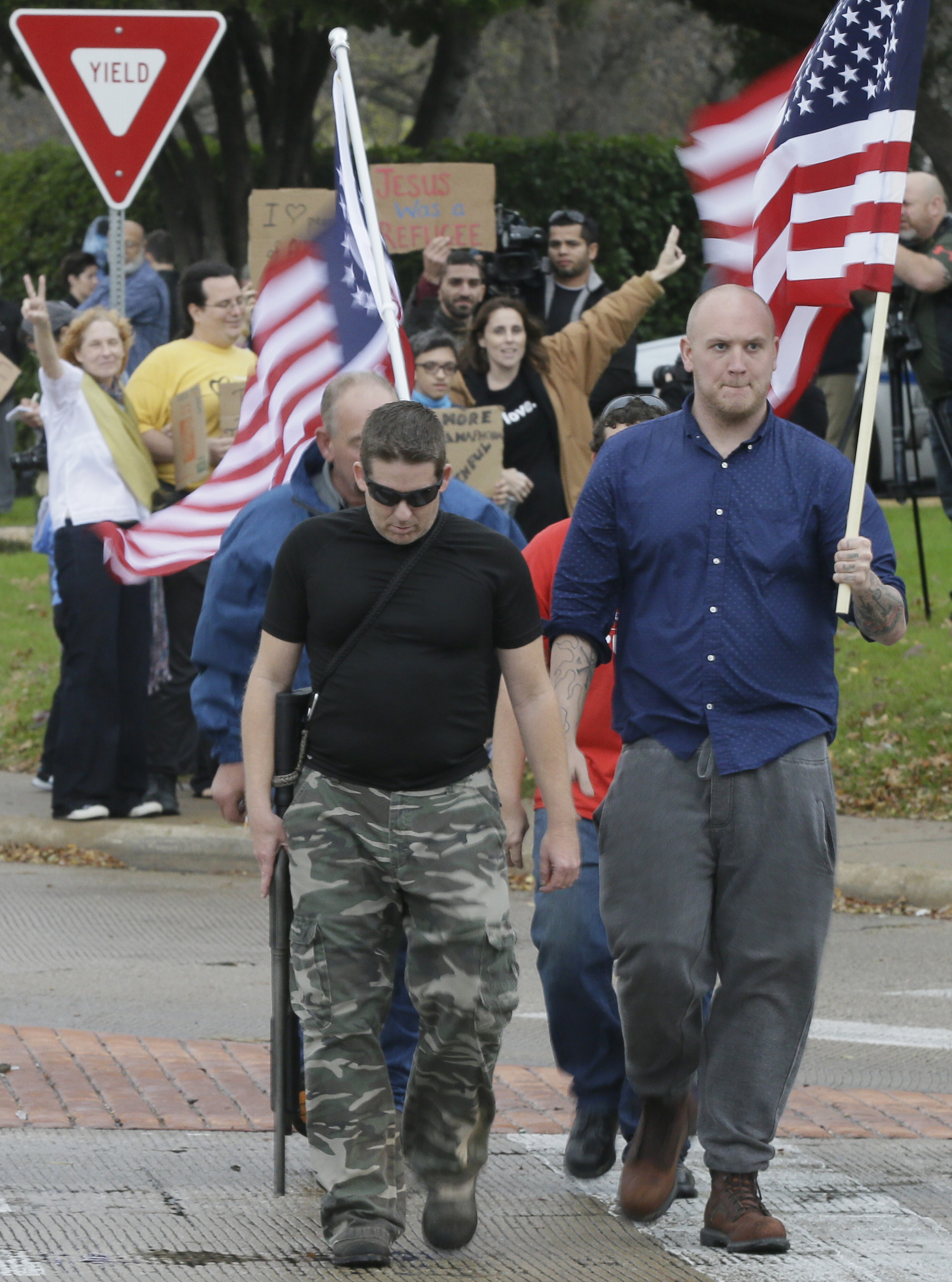 Anti-Muslim supporters walked across the street from counterprotestors outside a mosque in Texas, Dec. 12.